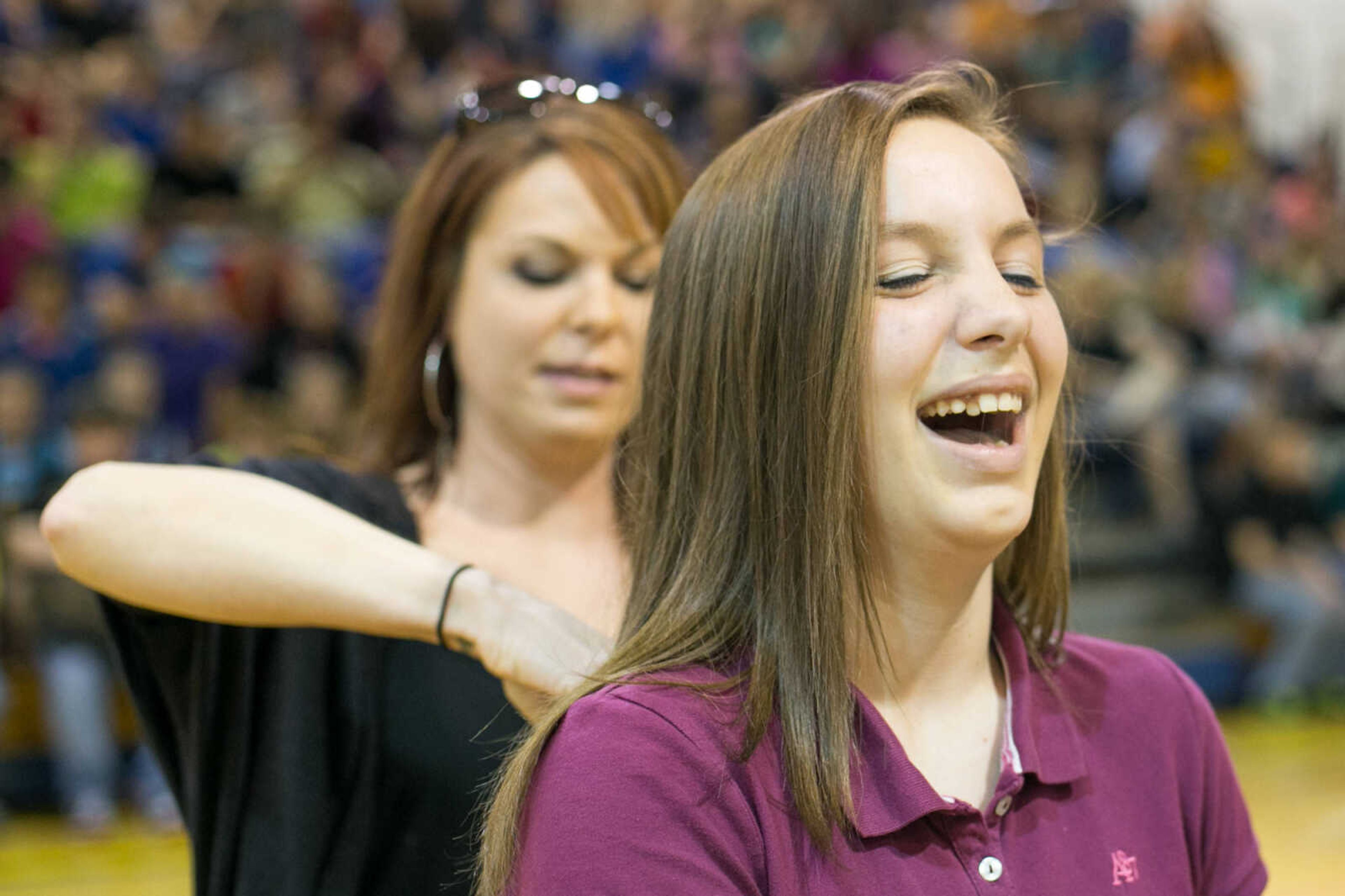 GLENN LANDBERG ~ glandberg@semissourian.com

Hailey Groesbeck reacts after having her hair cut and donated to the Beautiful Lengths program Monday, May 18, 2015 at Scott City High School. Twenty-four students and teachers participated in the event that provides wigs to cancer patients across the country.