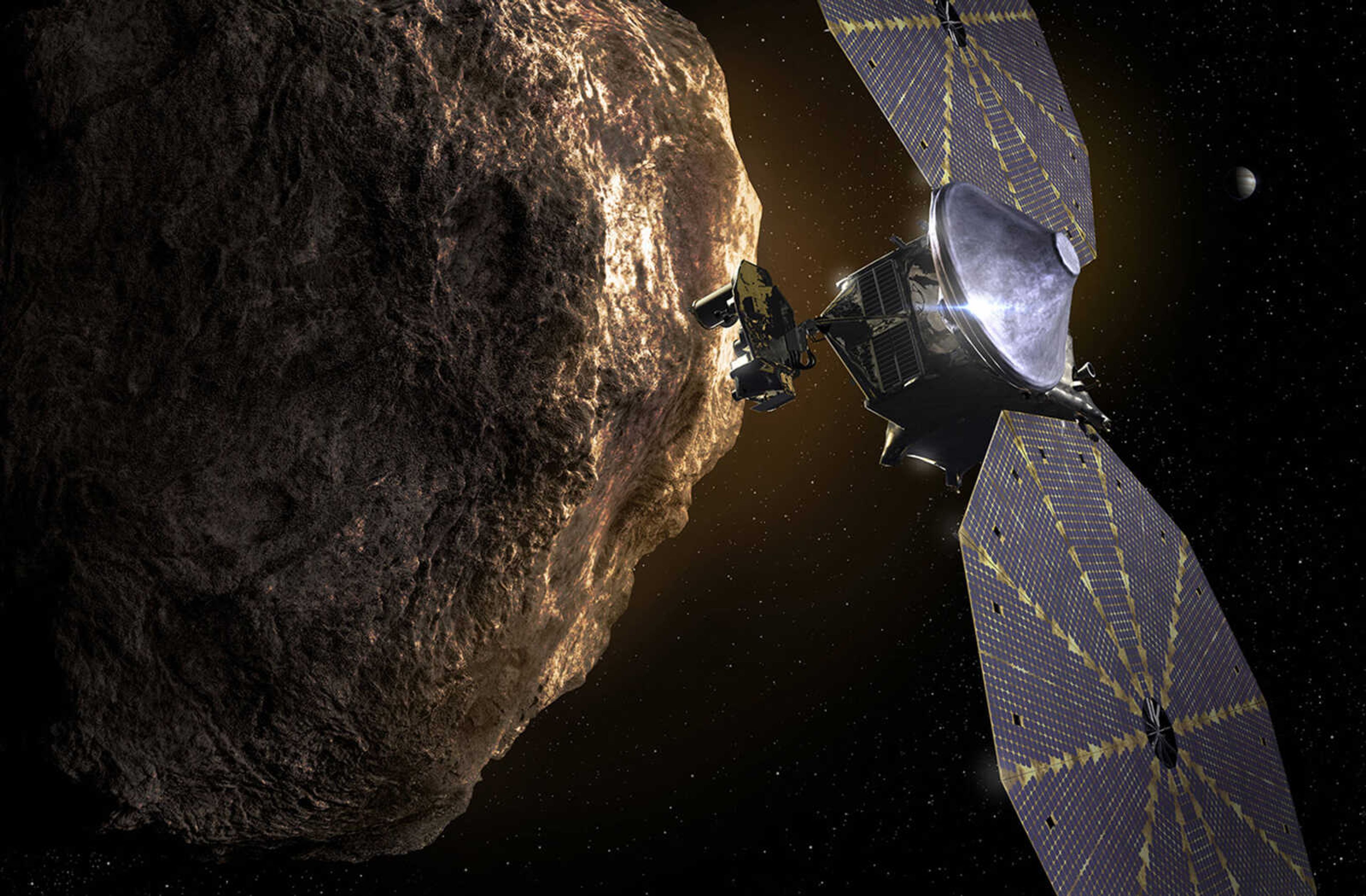 This image provided depicts the Lucy spacecraft approaching an asteroid. It will be first space mission to explore a diverse population of small bodies known as the Jupiter Trojan asteroids.
