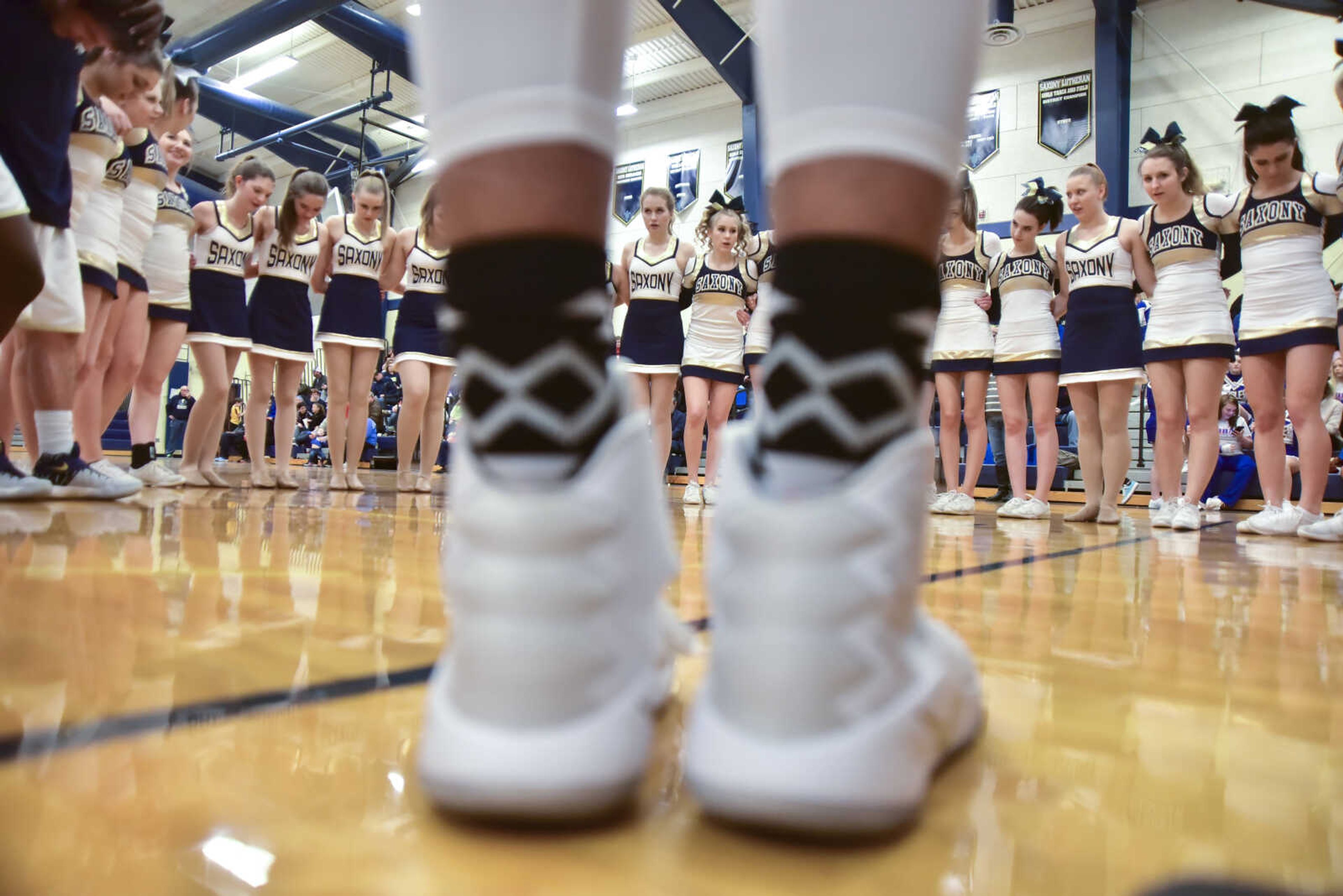 A prayer is said by the Saxony Lutheran basketball and cheer teams during a game between Oran and Saxony Lutheran Friday, Jan. 6, 2017 at Saxony Lutheran in Jackson.