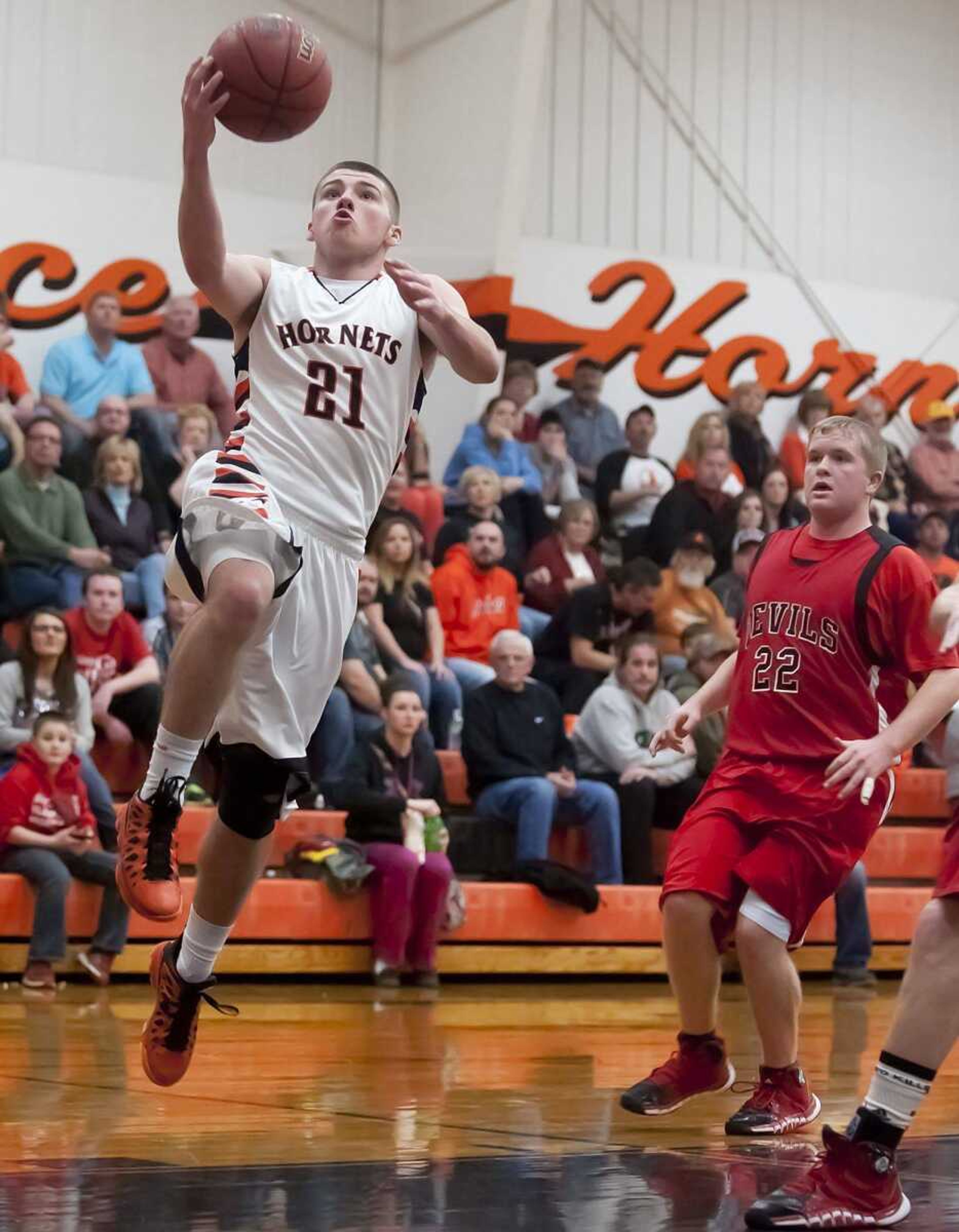 Advance's Austin Miller drives past Chaffee's Storm Estes for a layup Tuesday at Advance High School. Advance, which led by 23 points in the third quarter, had to rally in the final minute for a 76-72 victory. (Adam Vogler)