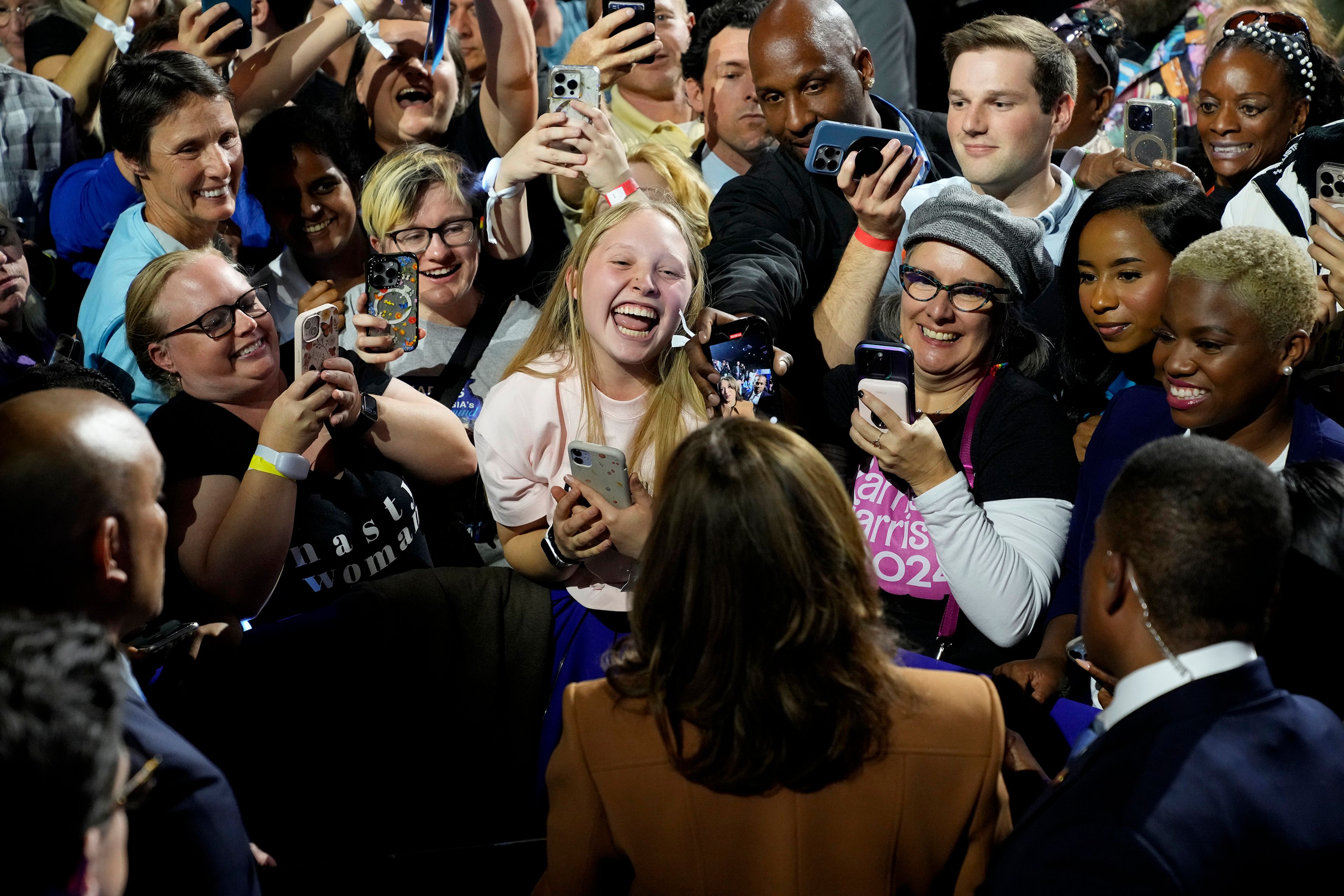 Democratic presidential nominee Vice President Kamala Harris, bottom center, greets supporters after speaking during a campaign rally at the Wings Event Center in Kalamazoo, Mich. 