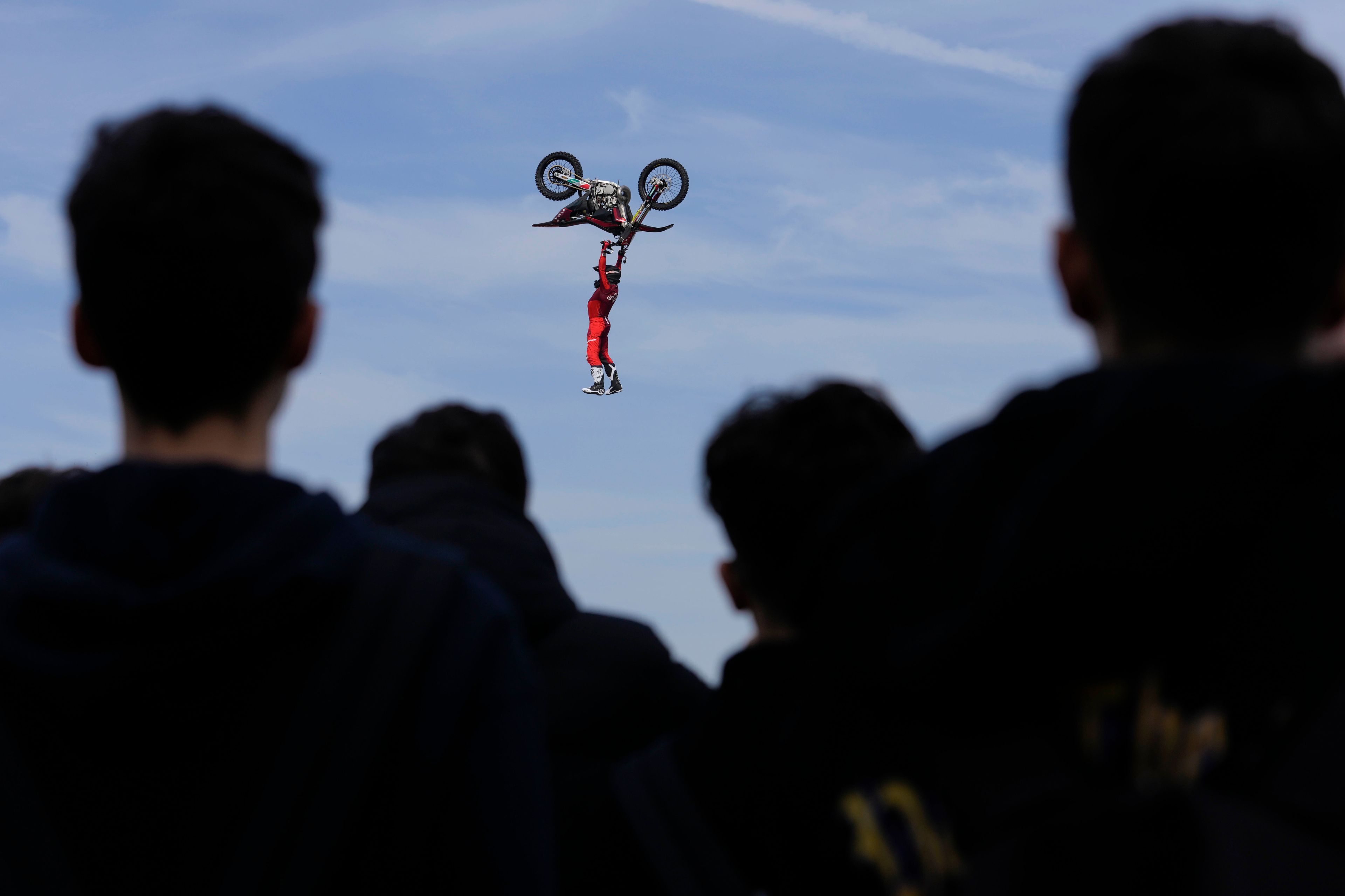 Riders perform during a freestyle motocross show at the EICMA exhibition motorcycle fair in Rho, outskirt of Milan, Italy, Thursday, Nov. 7, 2024. (AP Photo/Luca Bruno)