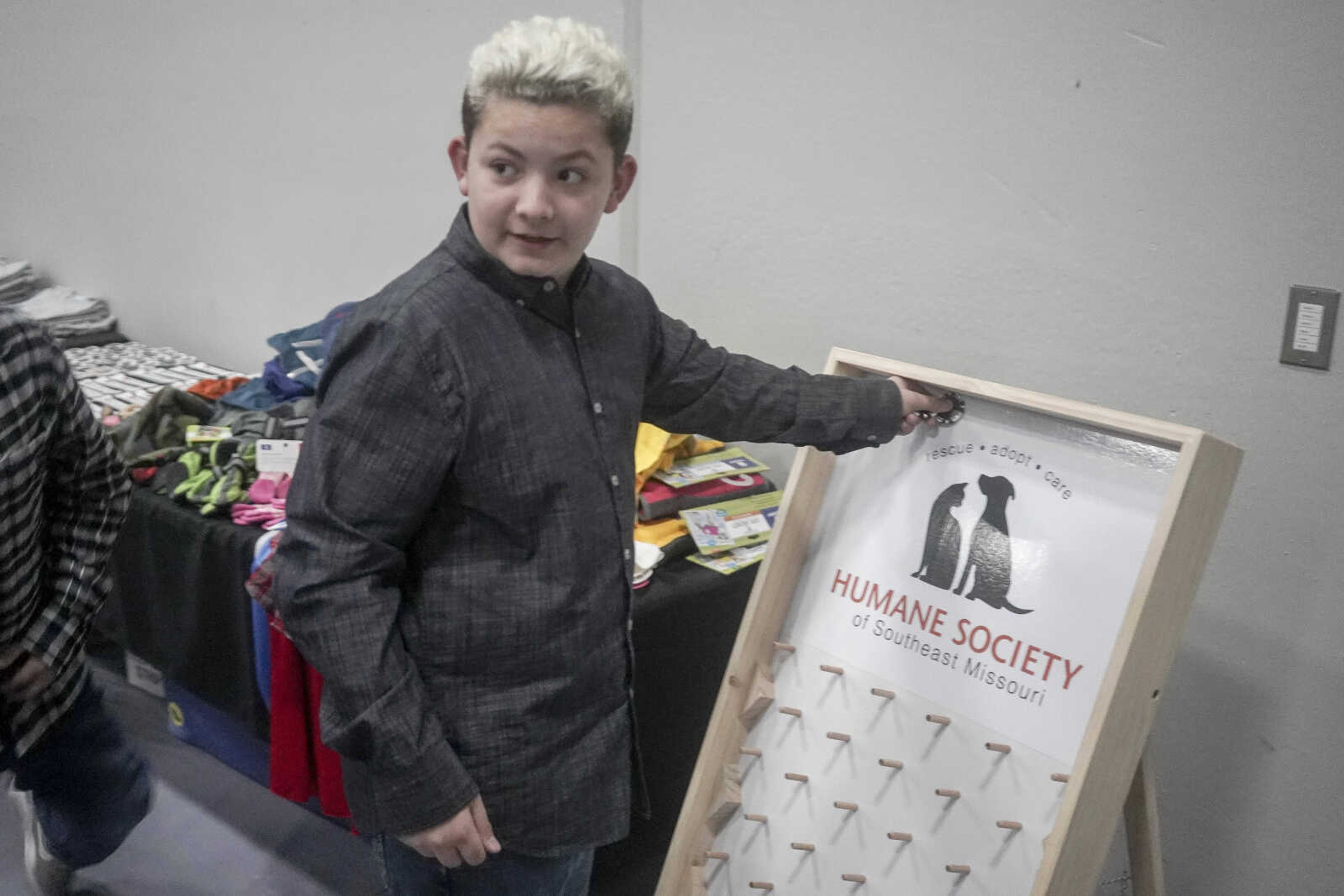 Austin Swofford plays plinko during the Humane Society of Southeast Missouri Power of Pawsitivity fundraiser Saturday, Feb. 29, 2020, at the Jackson Civic Center in Jackson. Swofford won candy.