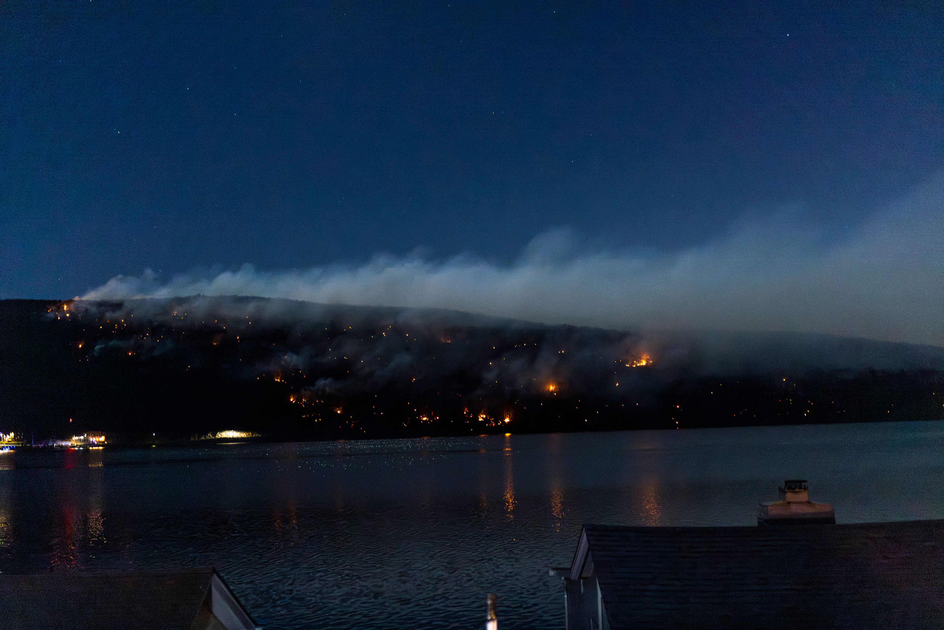 Wildfires burn along the New York and New Jersey border in Greenwood Lake, New York, Wednesday, Nov. 13, 2024. (AP Photo/Eduardo Munoz Alvarez)