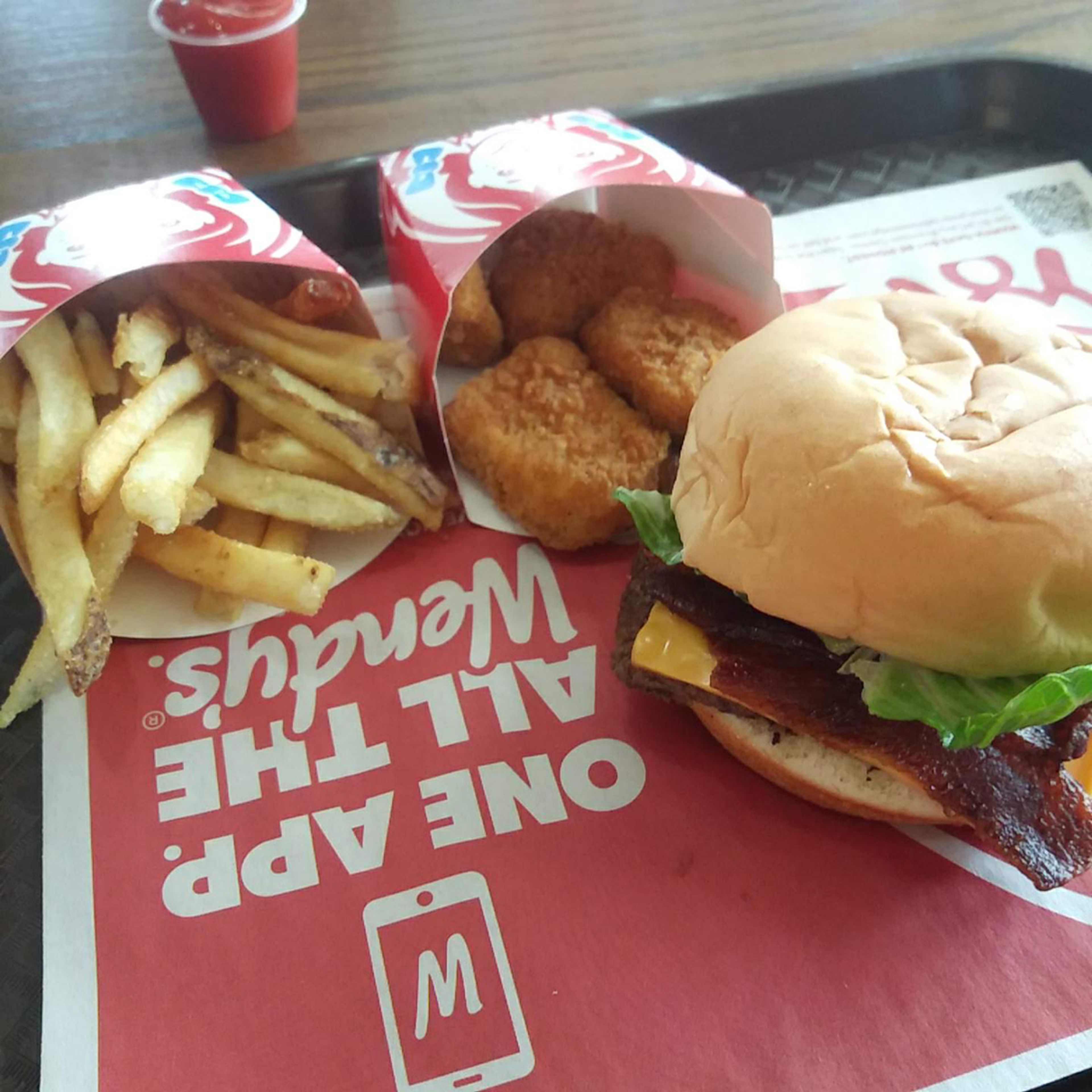 Wendy's Biggie Bag with a Jr. Bacon Cheeseburger. Not pictured but included is a small drink.