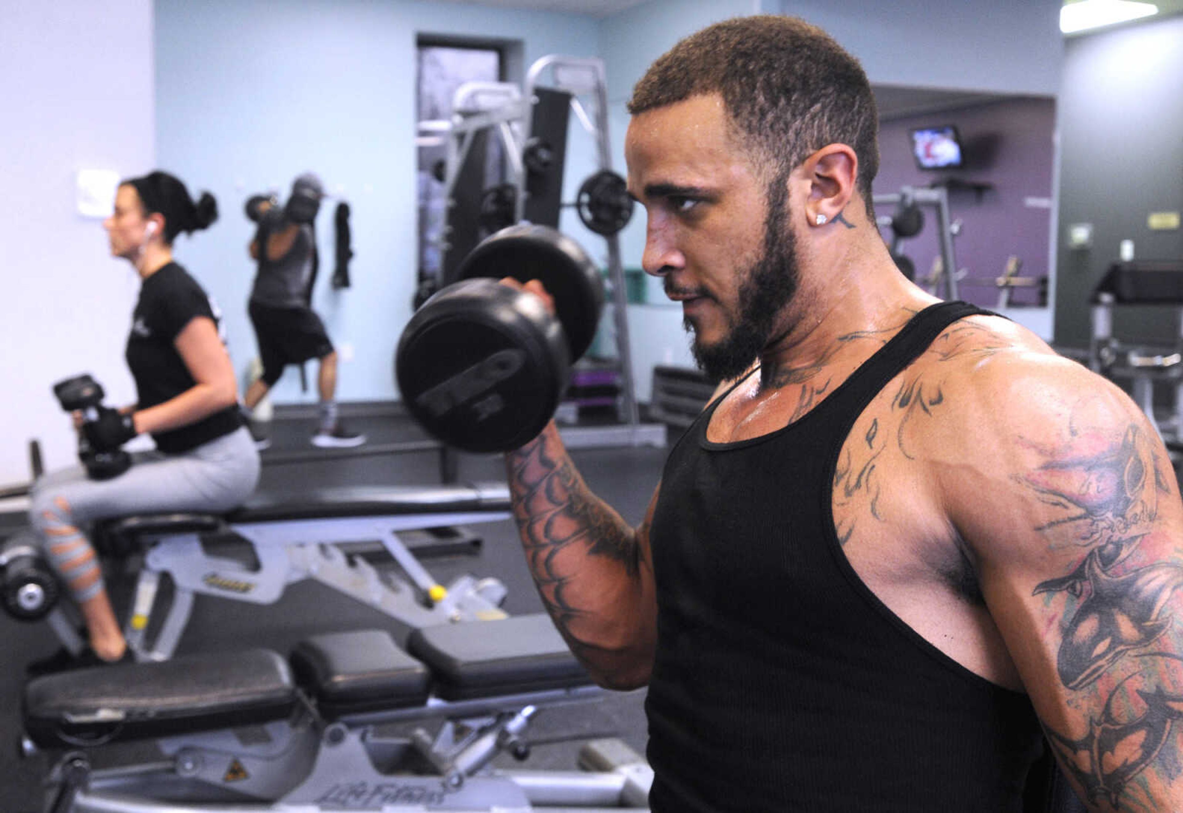 FRED LYNCH ~ flynch@semissourian.com
Monteal Pearson curls a dumbbell Monday, Jan. 2, 2017 at Anytime Fitness in Cape Girardeau.