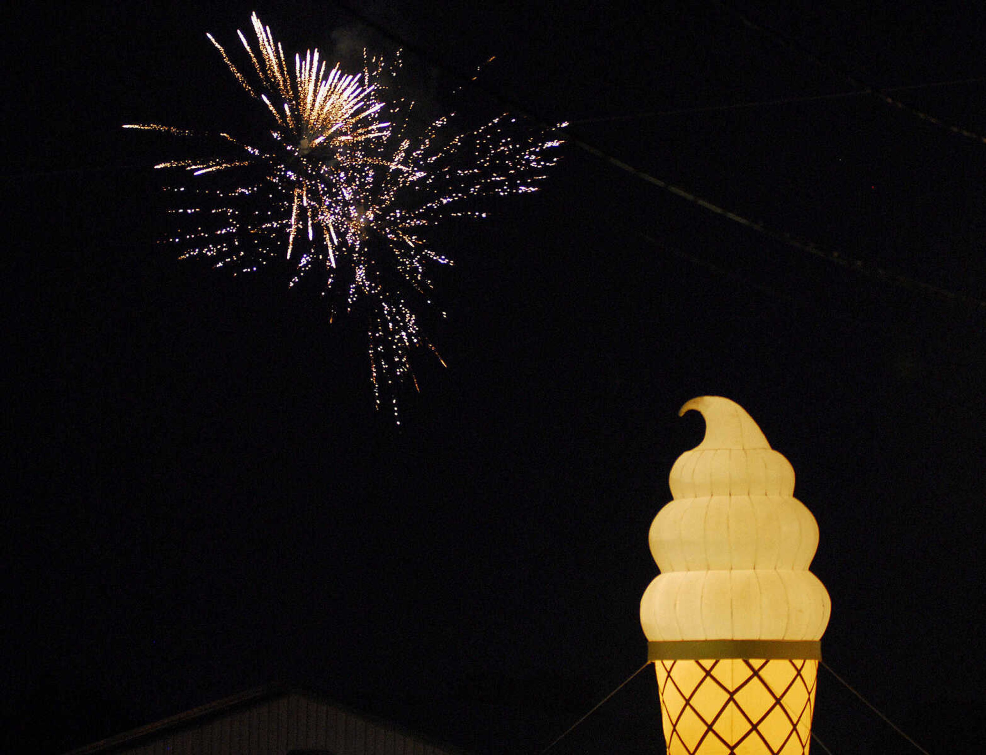 LAURA SIMON~lsimon@semissourian.com
Fireworks explode beyond an illuminated ice cream cone during the U.S.A. Veterans Fourth of July celebration at Arena Park in Cape Girardeau Sunday, July 4, 2010.