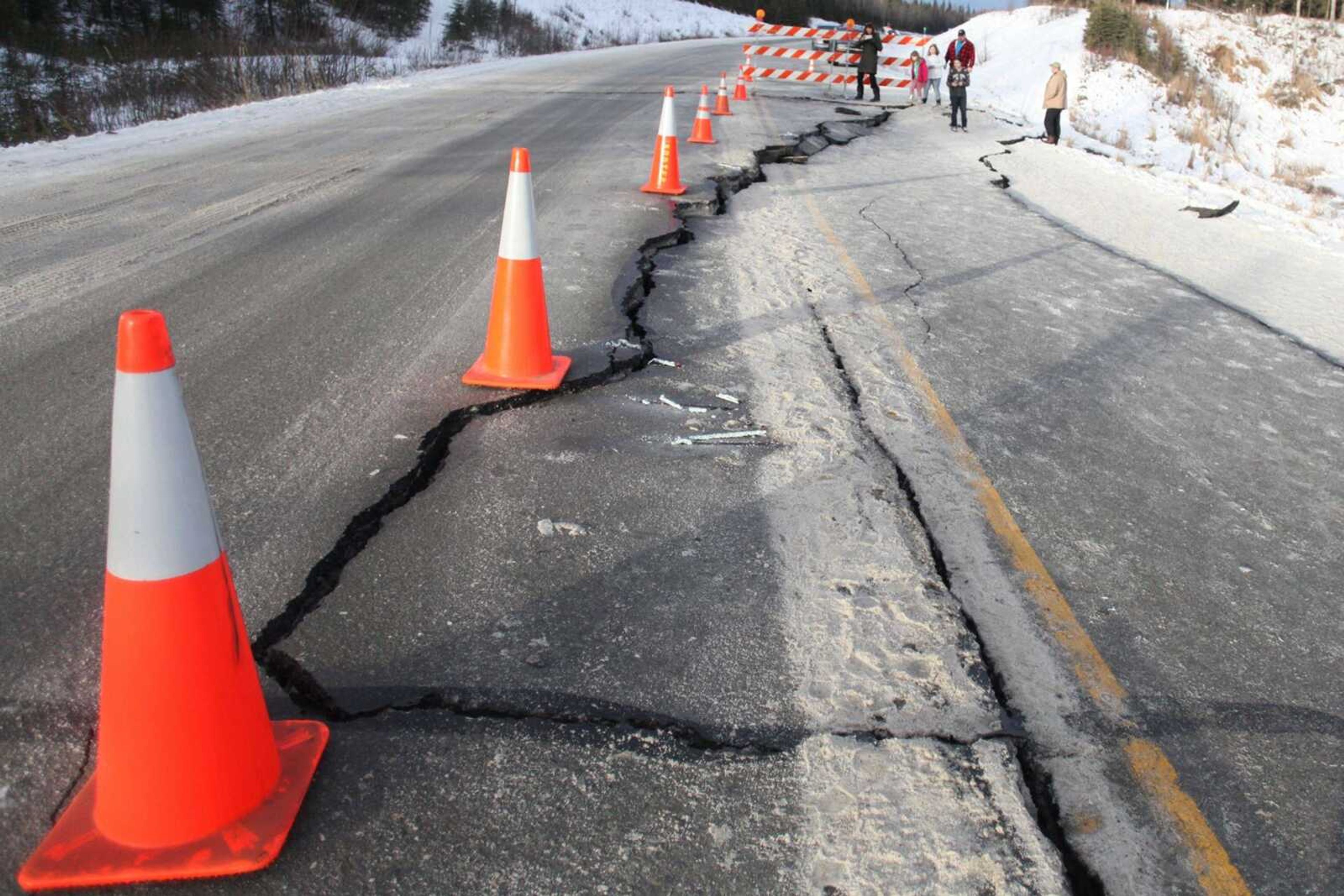 Cones mark a crack Sunday on Kalifornsky-Beach Road near Kasilof, Alaska, after a magnitude-7.1 earthquake.