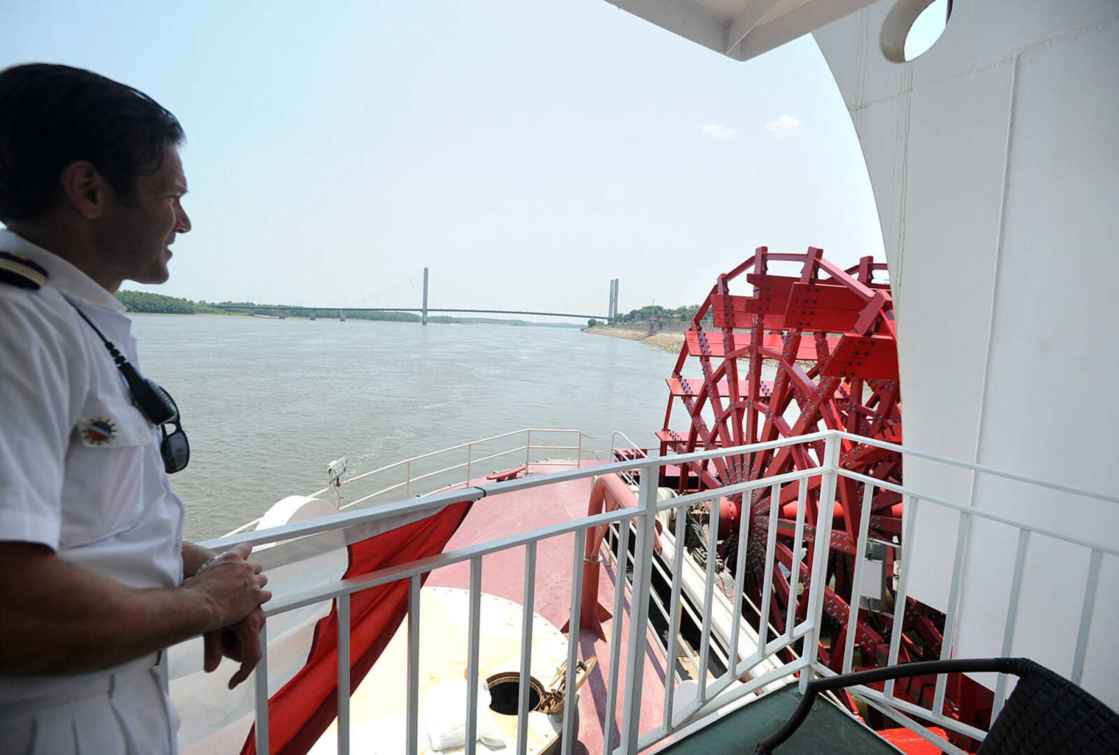 LAURA SIMON ~ lsimon@semissourian.com
Chief Mate John Cook looks south along the Mississippi River from the  rear deck of the American Queen steamboat Monday, July 2, 2012 while it is docked in downtown Cape Girardeau. The steamboat is traveling from Memphis, Tenn, to St. Louis, Mo.