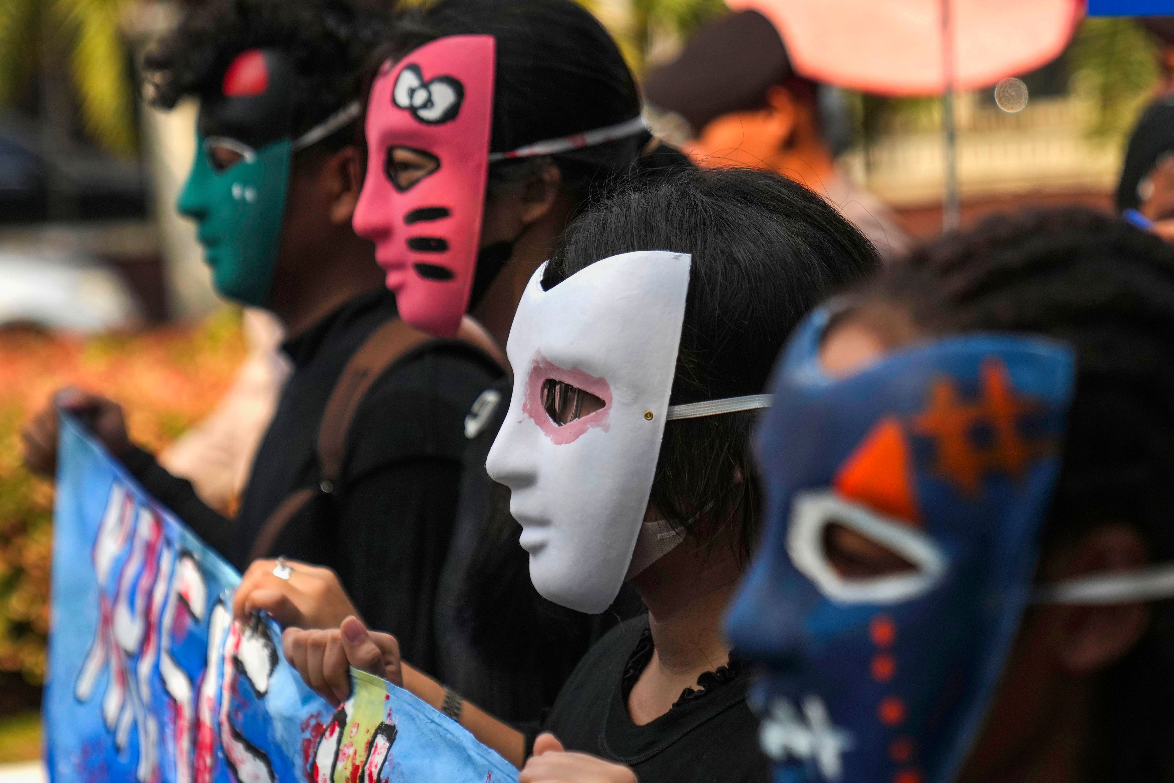 Masked activists take part in a Global Climate Strike rally in Jakarta, Indonesia, Friday, Sept. 27, 2024. (AP Photo/Dita Alangkara)