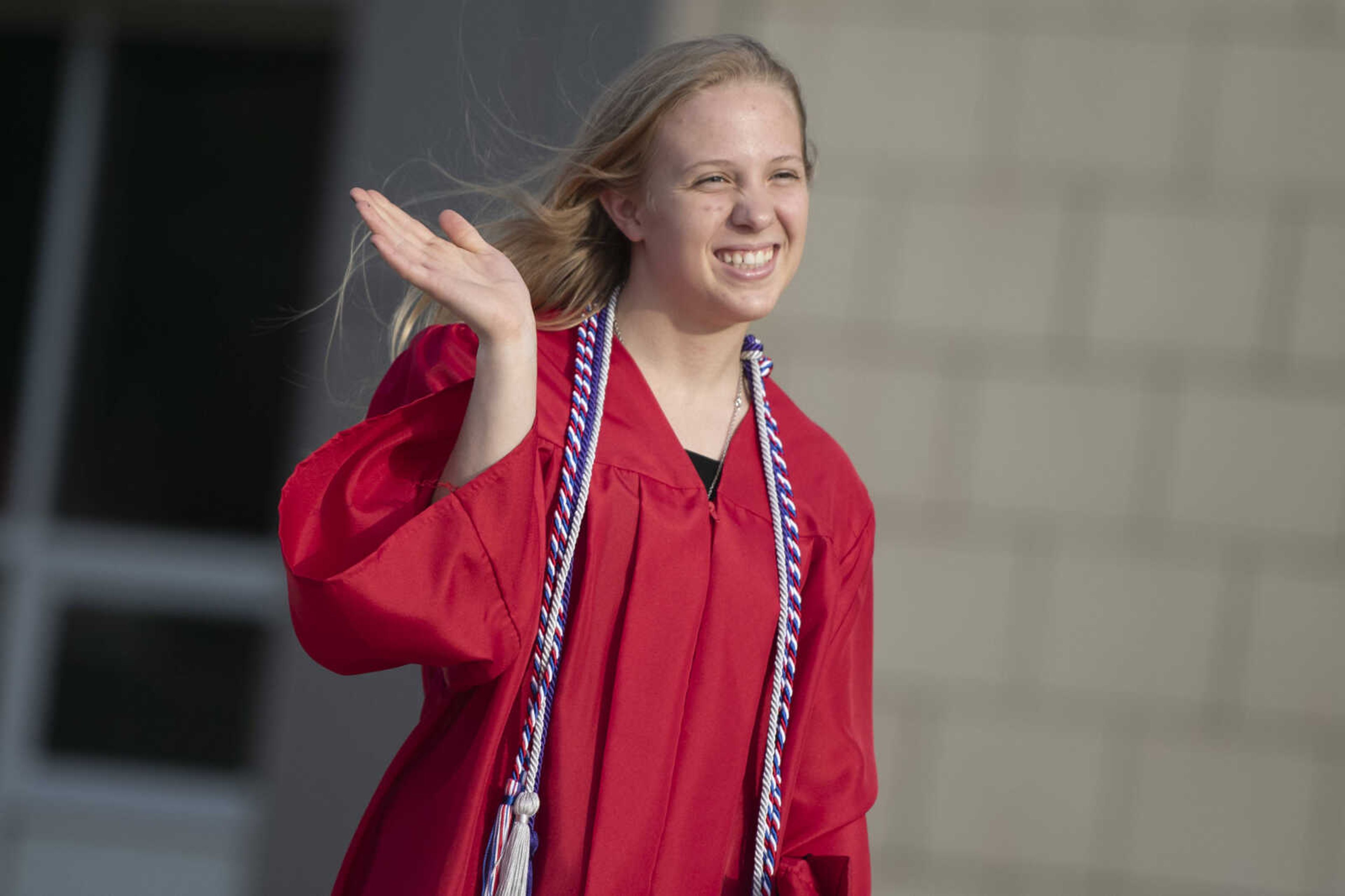 Jackson High School graduate Erin Taylor Huff waves during a parade following an in-person military graduation ceremony Friday, May 22, 2020, at Jackson High School.