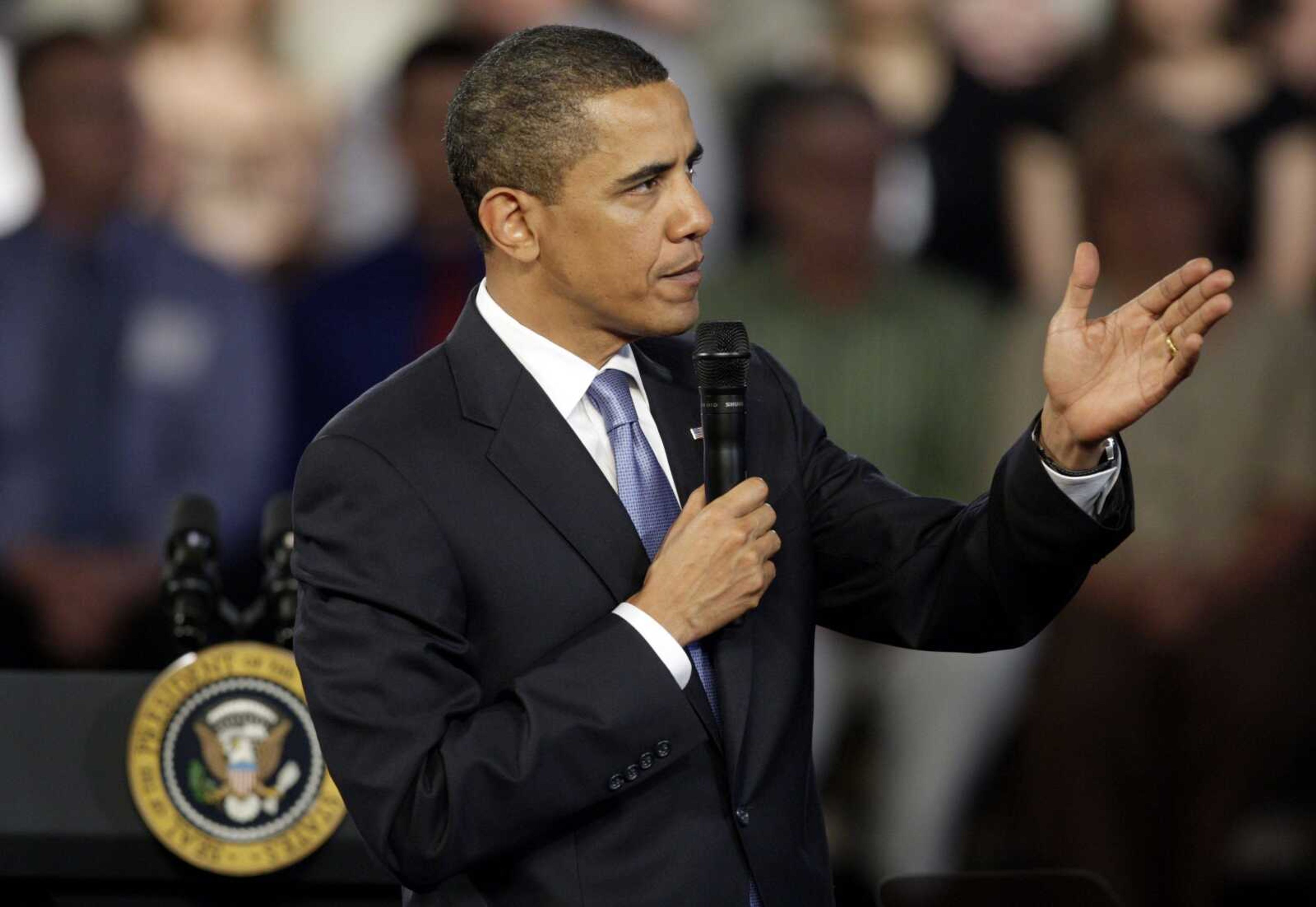 President Barack Obama answers a questions from an audience member during a town hall meeting Wednesday, April 29, 2009, at Fox Senior High School in Arnold, Mo. (AP Photo/Jeff Roberson)