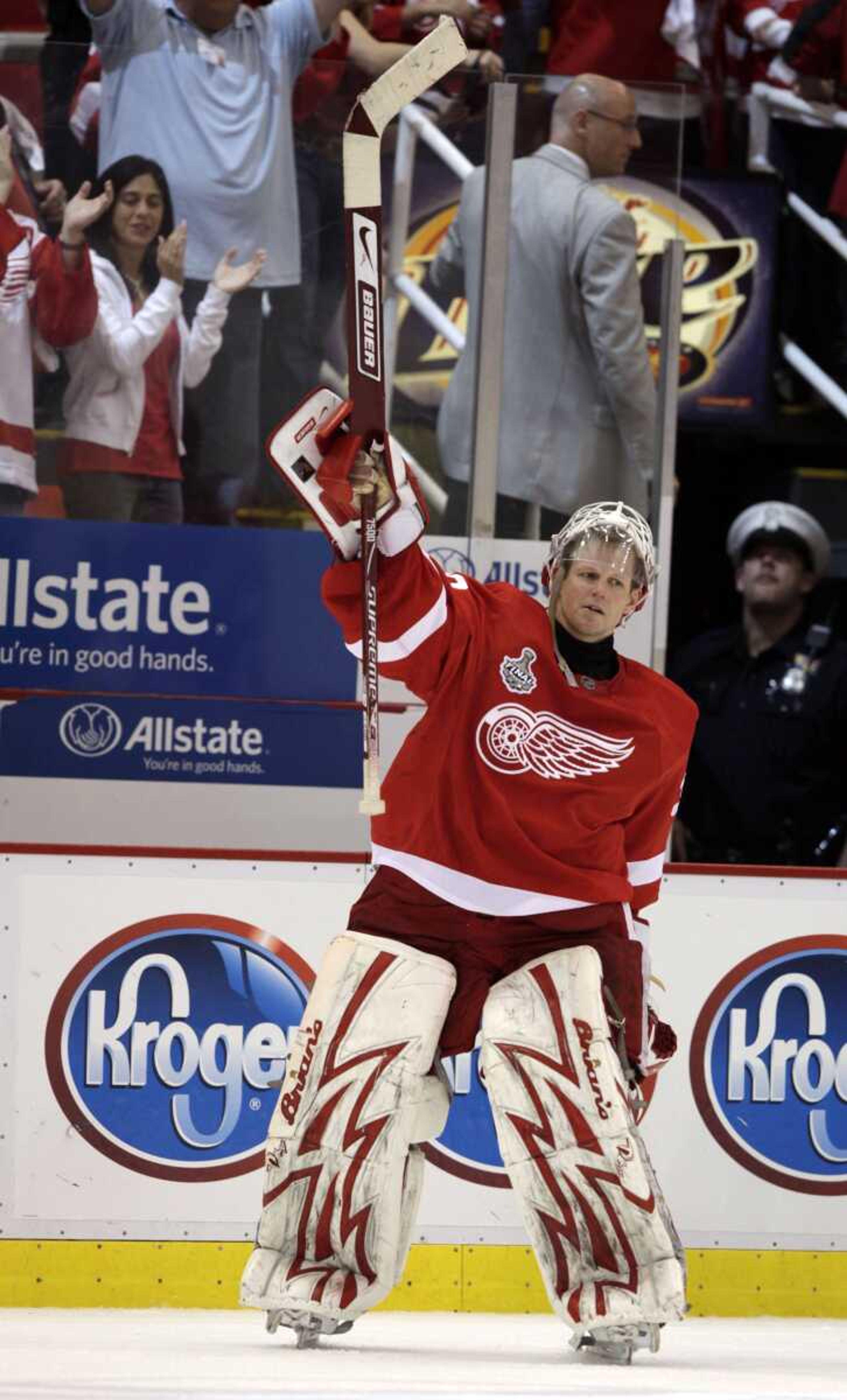 Red Wings goalie Chris Osgood waves to fans after Game 2 Sunday in Detroit. (PAUL SANCYA ~ Associated Press)