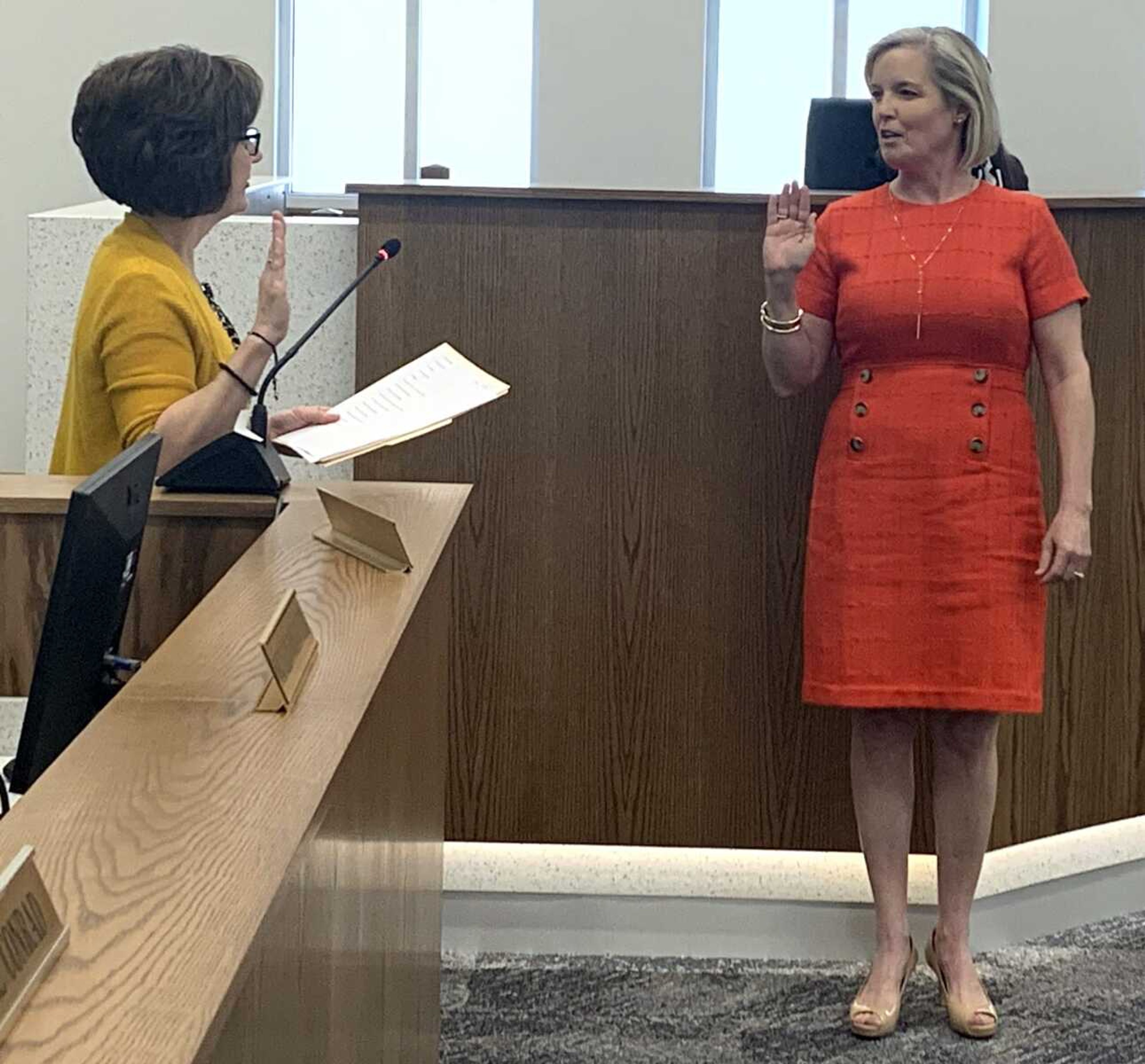 Stacy Kinder, right, is sworn in as Cape Girardeau mayor by city clerk Gayle Conrad on Monday during the City Council meeting at City Hall in downtown Cape Girardeau. City Council members Tameka Randle, Mark Bliss and Dan Presson were also sworn in to office at the meeting.