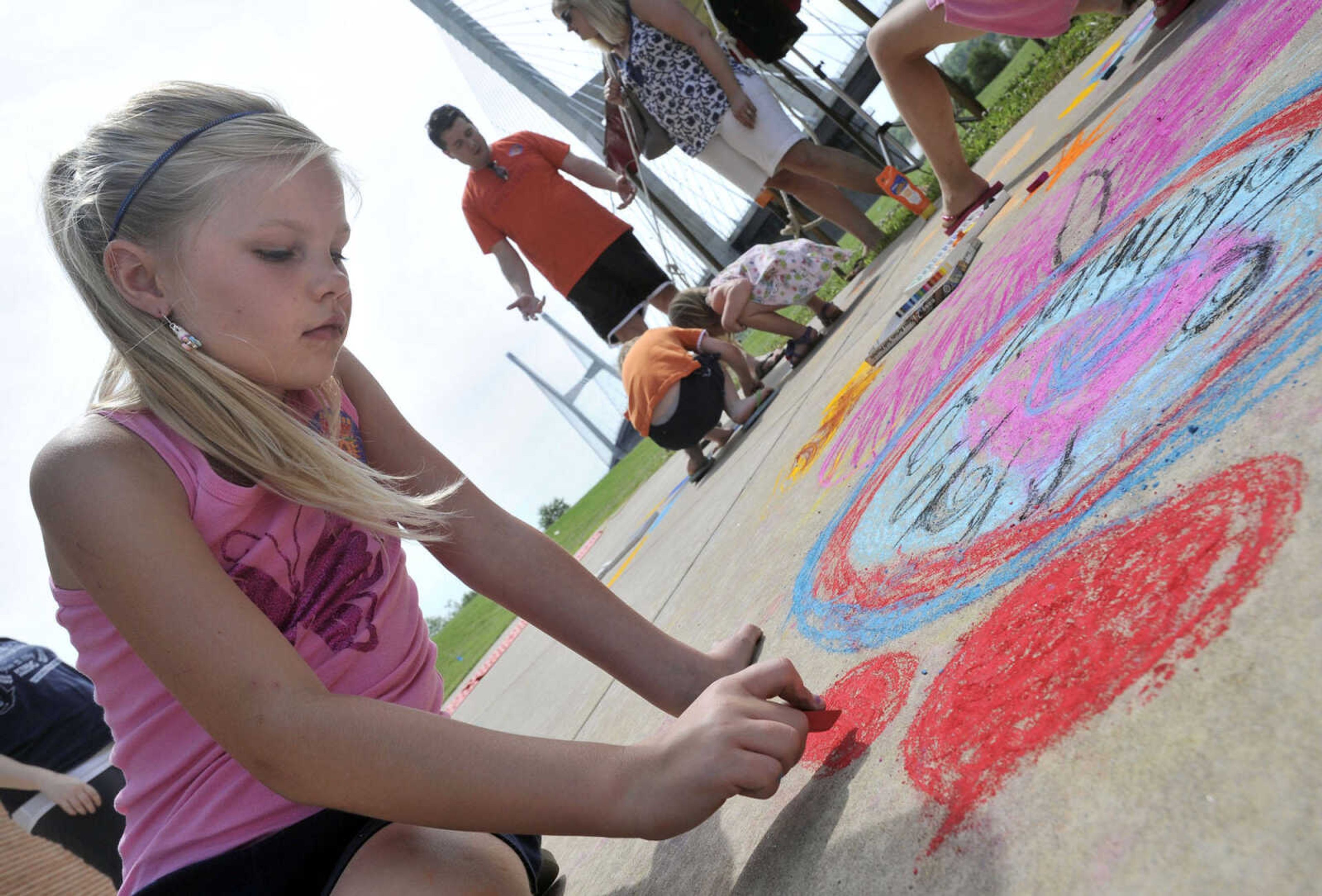 Kyleigh Nickell contributes her talent to the Avenue of Art Saturday, June 21, 2014 at the River Campus Summer Arts Festival in Cape Girardeau.