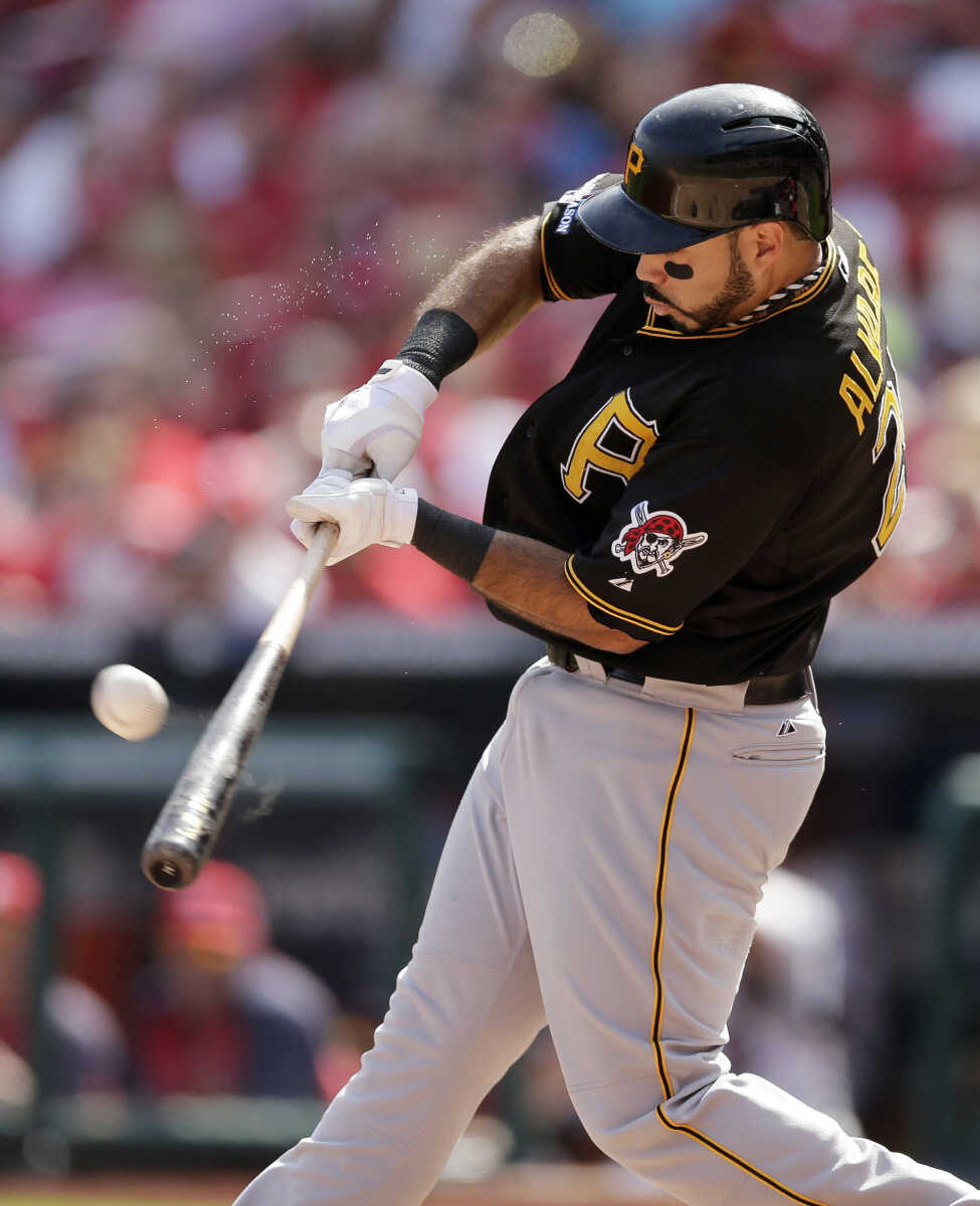 Pittsburgh Pirates' Pedro Alvarez hits a double against the St. Louis Cardinals in the second inning of Game 2 of baseball's National League division series on Friday, Oct. 4, 2013, in St. Louis. (AP Photo/Charlie Riedel)