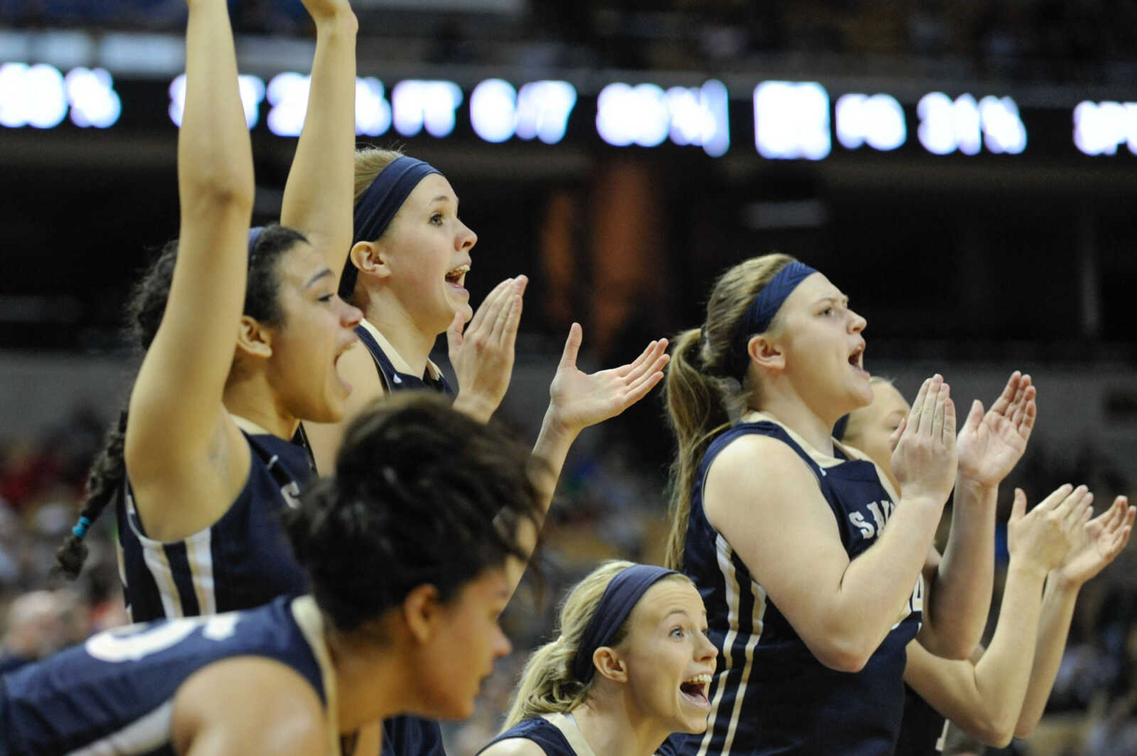 The Saxony Lutheran bench celebrates during a fourth-quarter rally in the Class 3 state championship on Friday at Mizzou Arena in Columbia, Missouri.