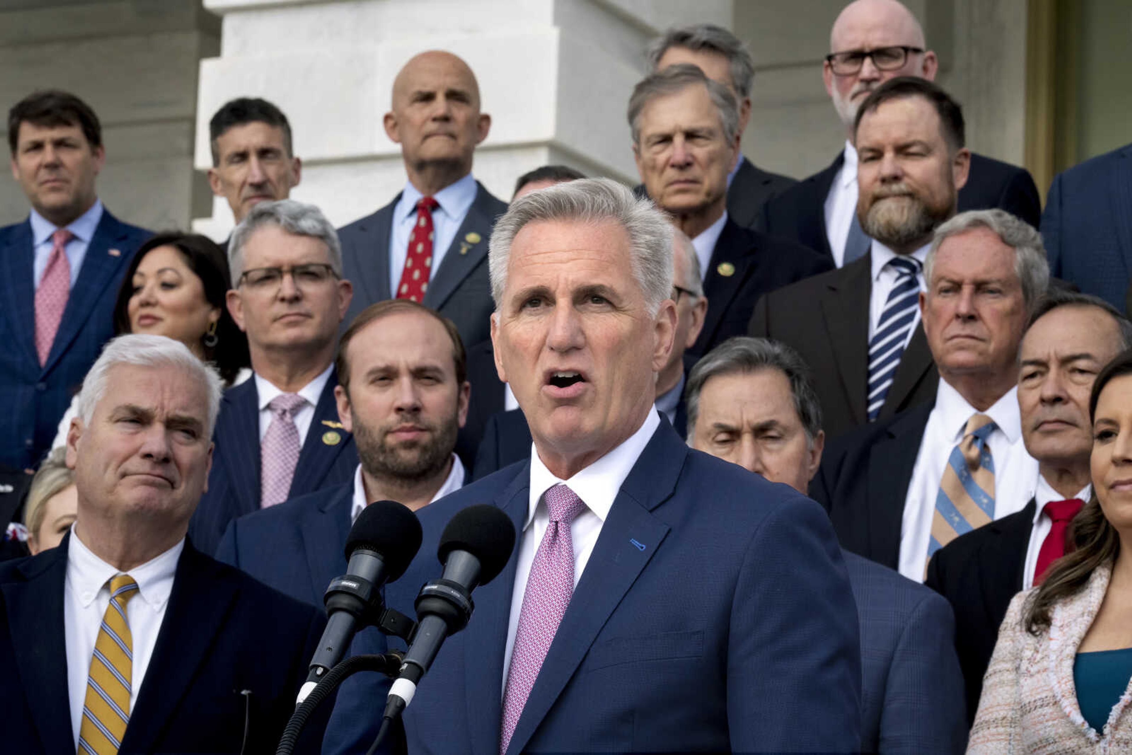 Speaker of the House Kevin McCarthy, R-Calif., holds an event to mark 100 days of the Republican majority in the House on Monday at the Capitol in Washington. In a speech Monday at the New York Stock Exchange, the Republican leader accused President Joe Biden of refusing to engage in budget-cutting negotiations to prevent a debt crisis.