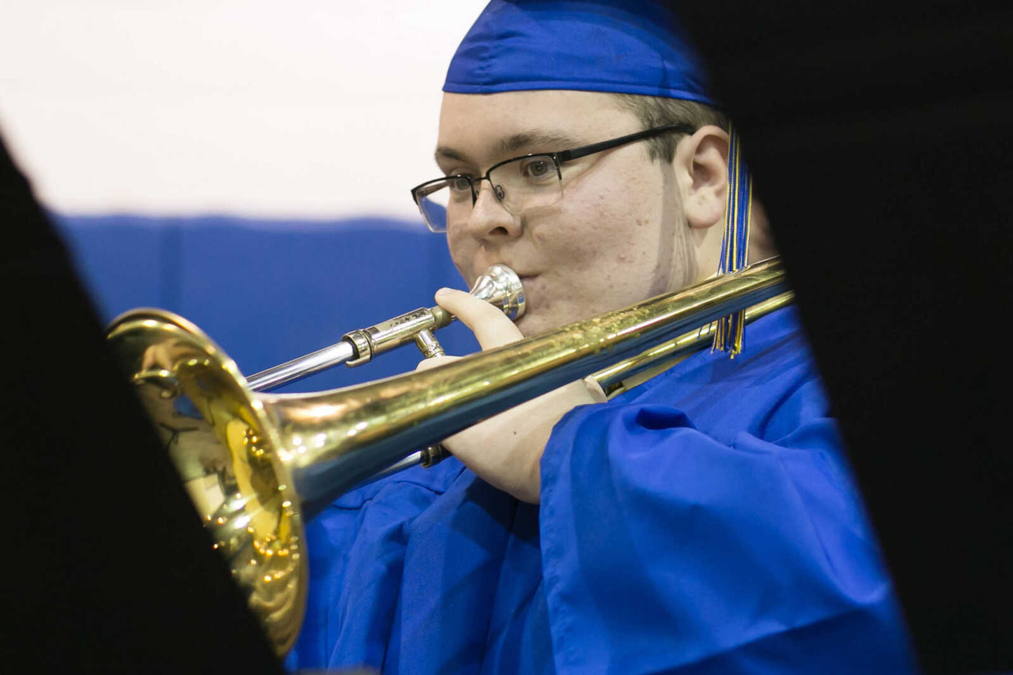 GLENN LANDBERG ~ glandberg@semissourian.com

A member of the Scott City Concert Band plays the trombone during the Scott City commencement Sunday, May 17, 2015 at Scott City High School.