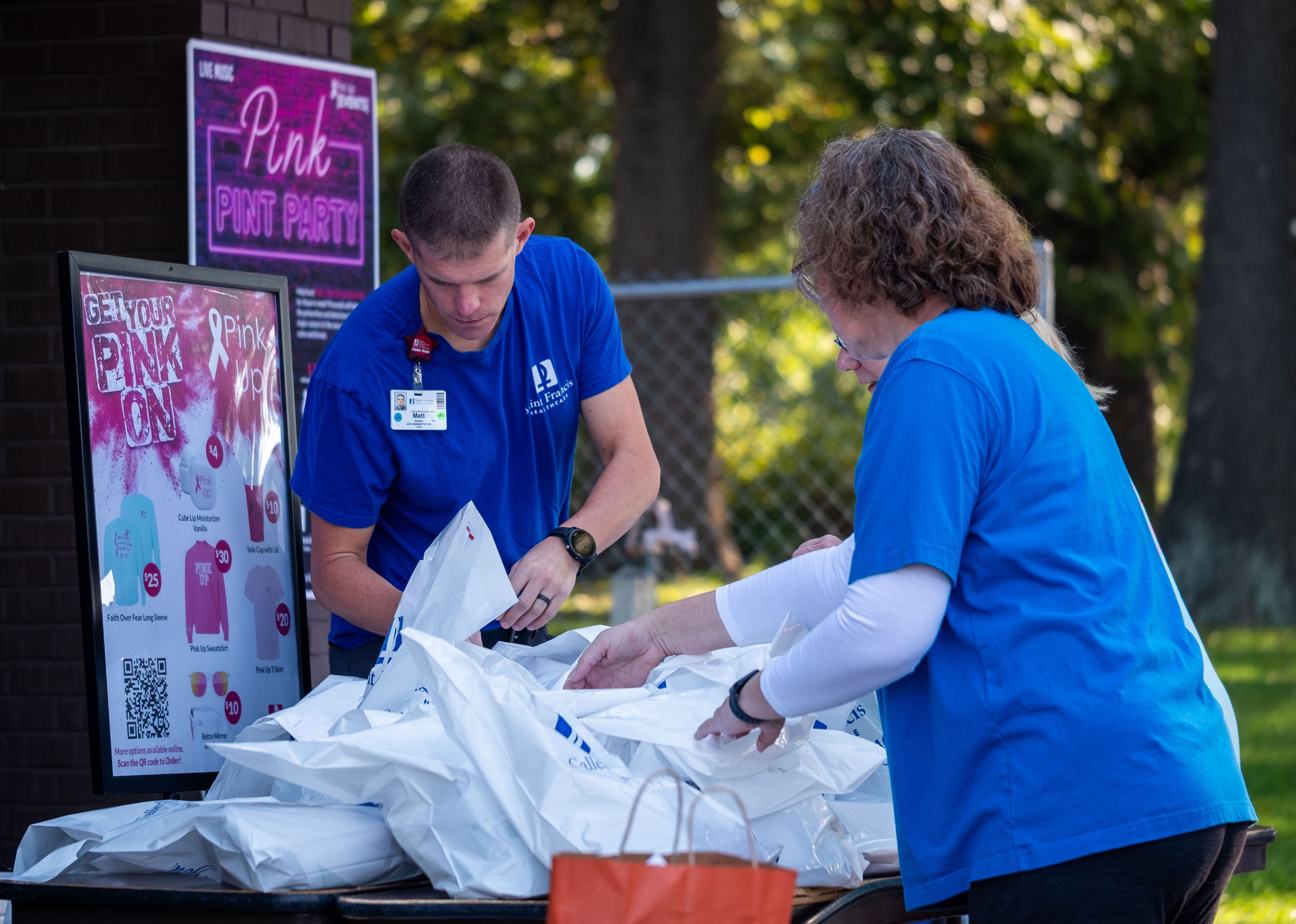 Saint Francis Foundation volunteers gather gift bags for each participant.
