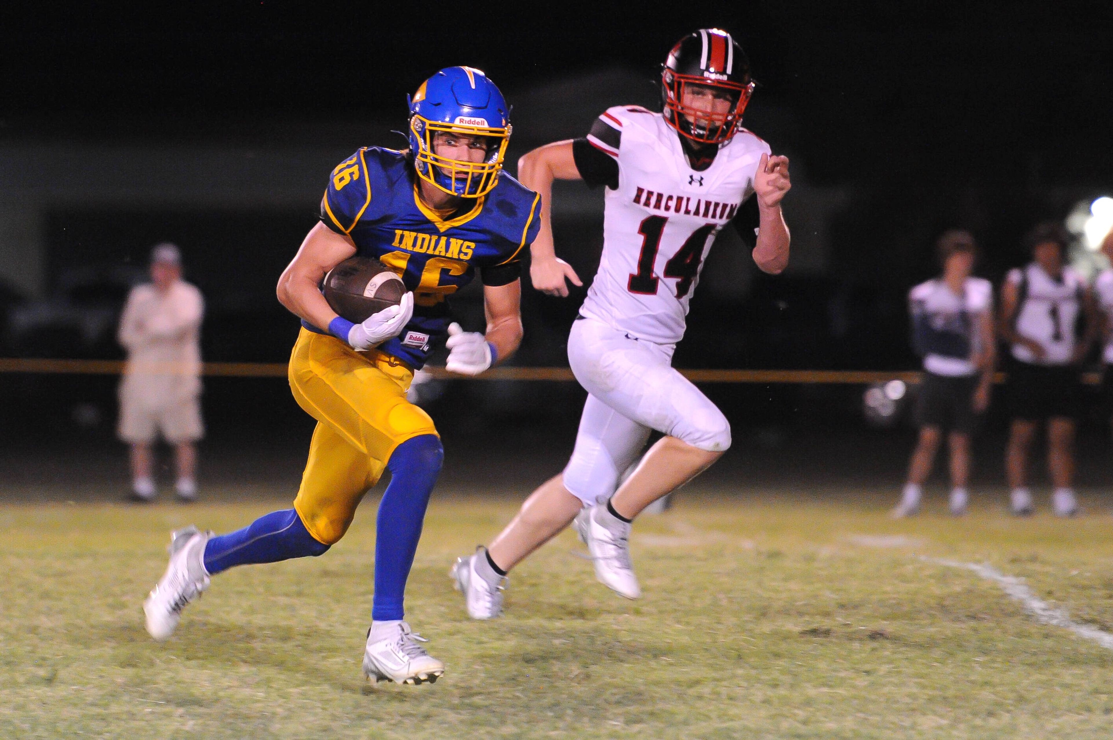 St. Vincent's John Schwartz (left) turns upfield after receiving a pass during a Friday, September 20, 2024 game between the St. Vincent Indians and the Herculaneum Blackcats at St. Vincent High School in Perryville, Mo. St. Vincent defeated Herculaneum, 47-7. 