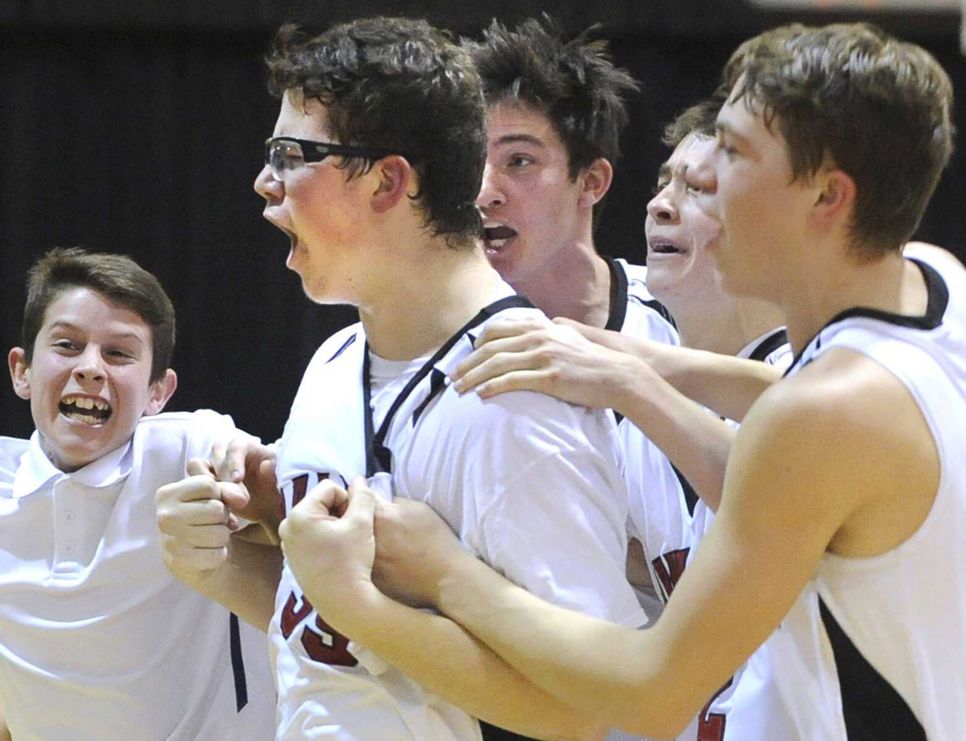 Bell City's Bobby Wright celebrates with teammates after he scored the final shot for their 63-62 victory over Oran on Friday, Feb. 5, 2016 in Bell City, Missouri.