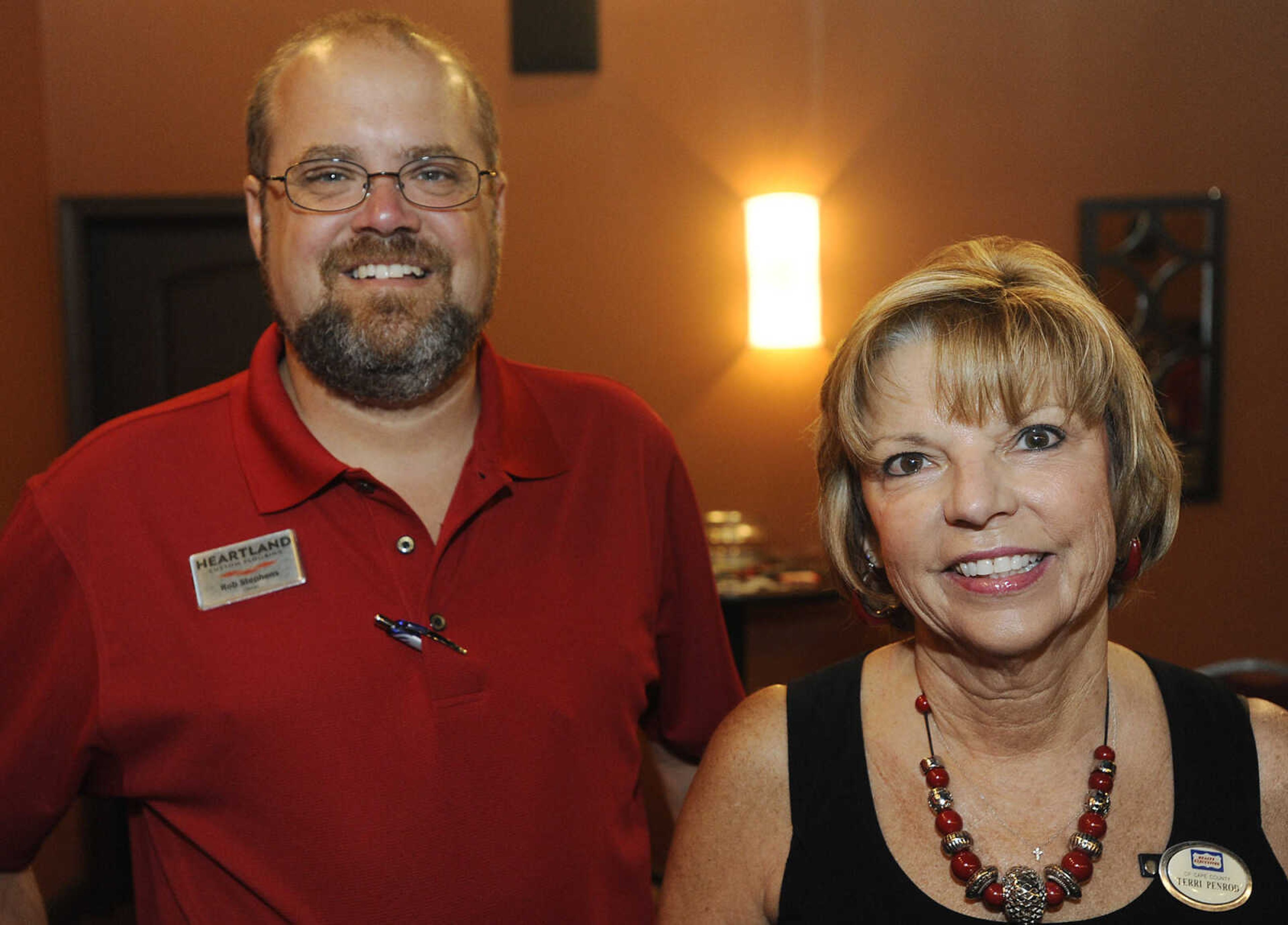 Rob Stephens of Heartland Custom Flooring, left, and Terri Penrod of Realty Executives of Cape County at the Jackson Area Chamber of Commerce Business Breakfast Friday, July 19, at Creative Edge 160 Enterprise, Jackson, Mo.