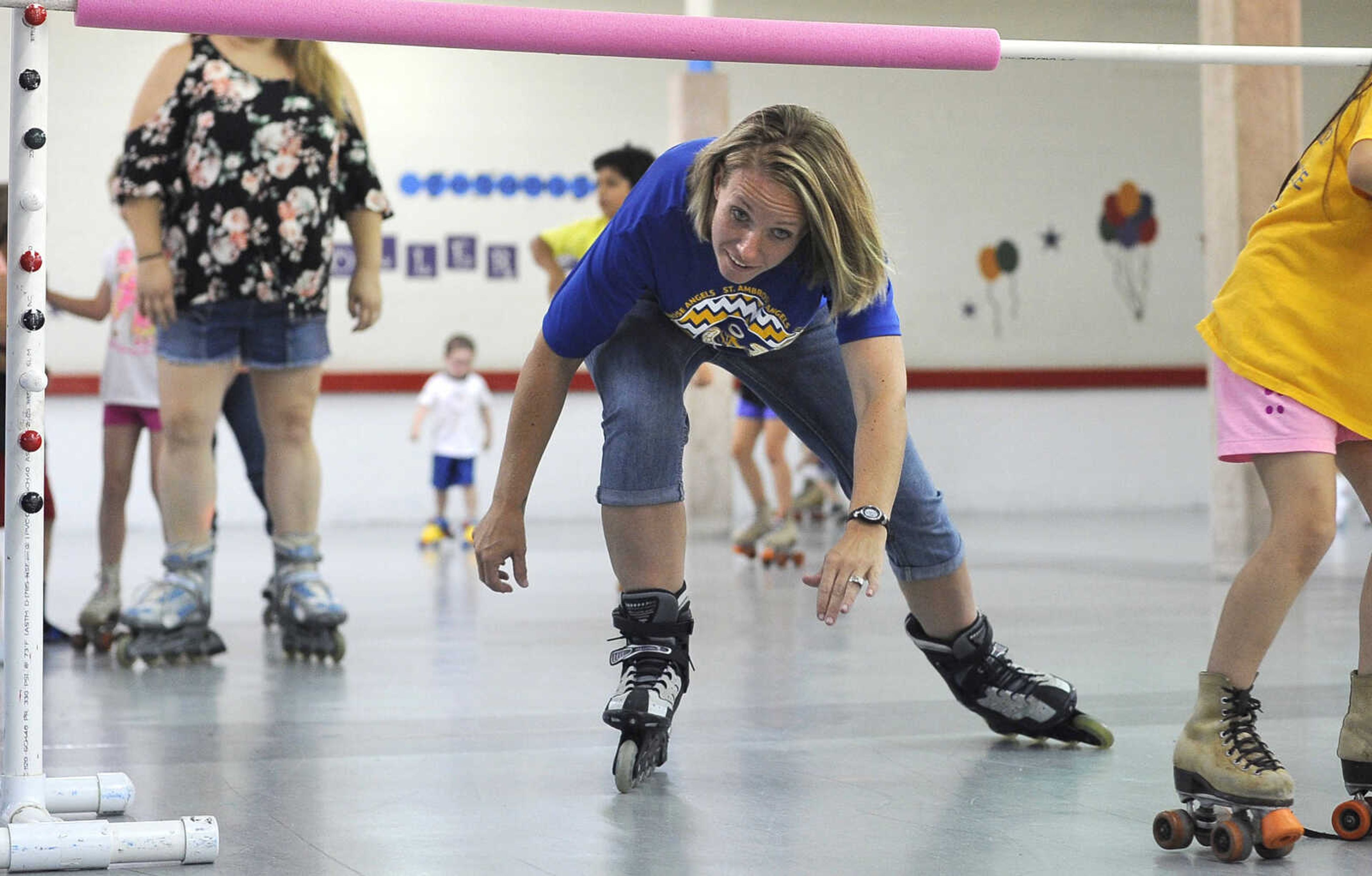 FRED LYNCH ~ flynch@semissourian.com
Amanda McIntosh skates under the bar during a limbo contest Sunday, Aug. 12, 2018 at Willow Grove Roller Rink in Chaffee, Missouri.