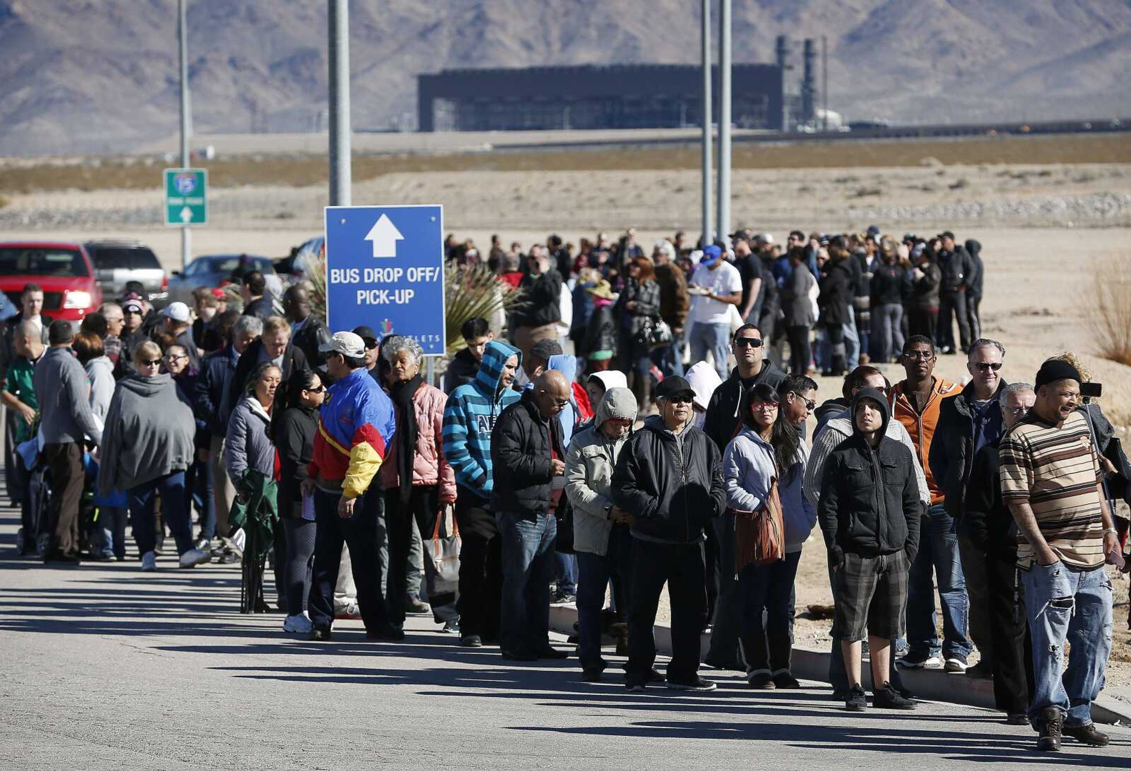 Patrons line up to buy Powerball lottery tickets outside the Primm Valley Casino Resorts Lotto Store just inside the California border Tuesday near Primm, Nevada. The Powerball jackpot has grown to over $1.3 billion for the next drawing today. (John Locher ~ Associated Press)