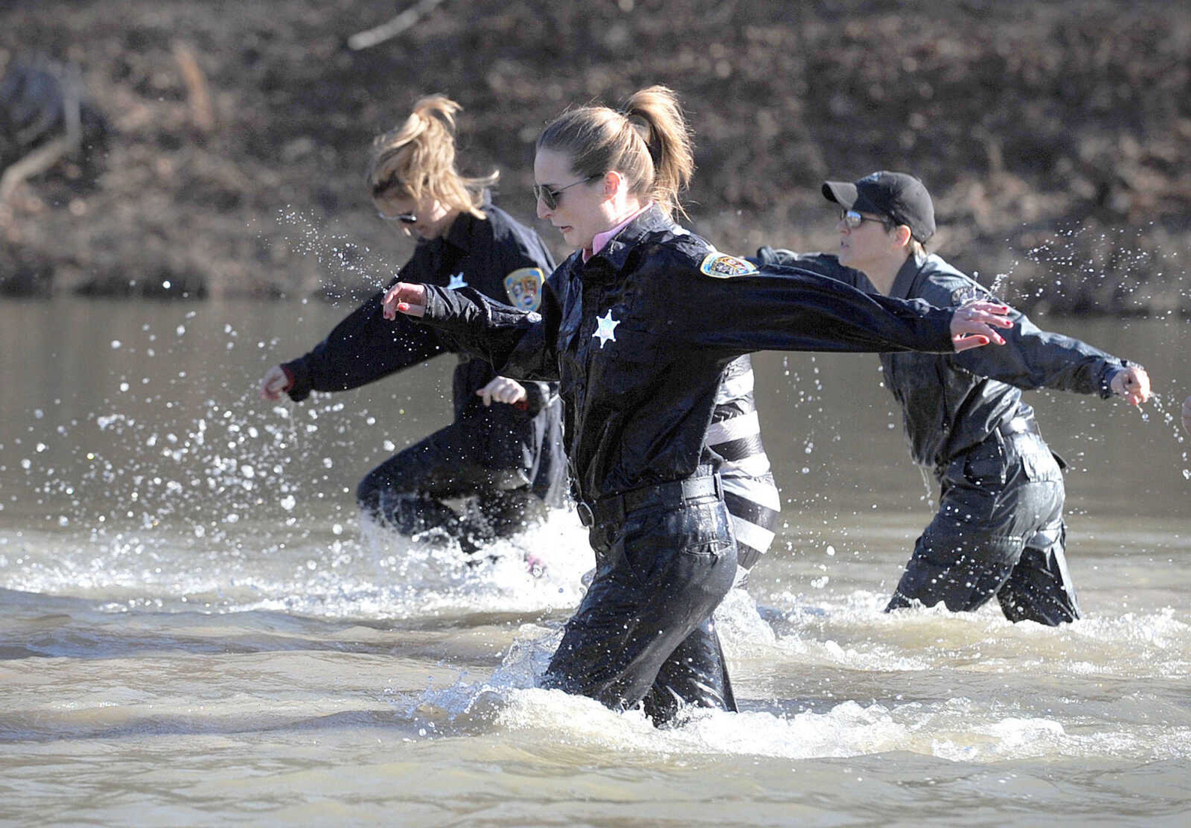 LAURA SIMON ~ lsimon@semissourian.com
People plunge into the cold waters of Lake Boutin Saturday afternoon, Feb. 2, 2013 during the Polar Plunge at Trail of Tears State Park. Thirty-six teams totaling 291 people took the annual plunge that benefits Special Olympics Missouri.