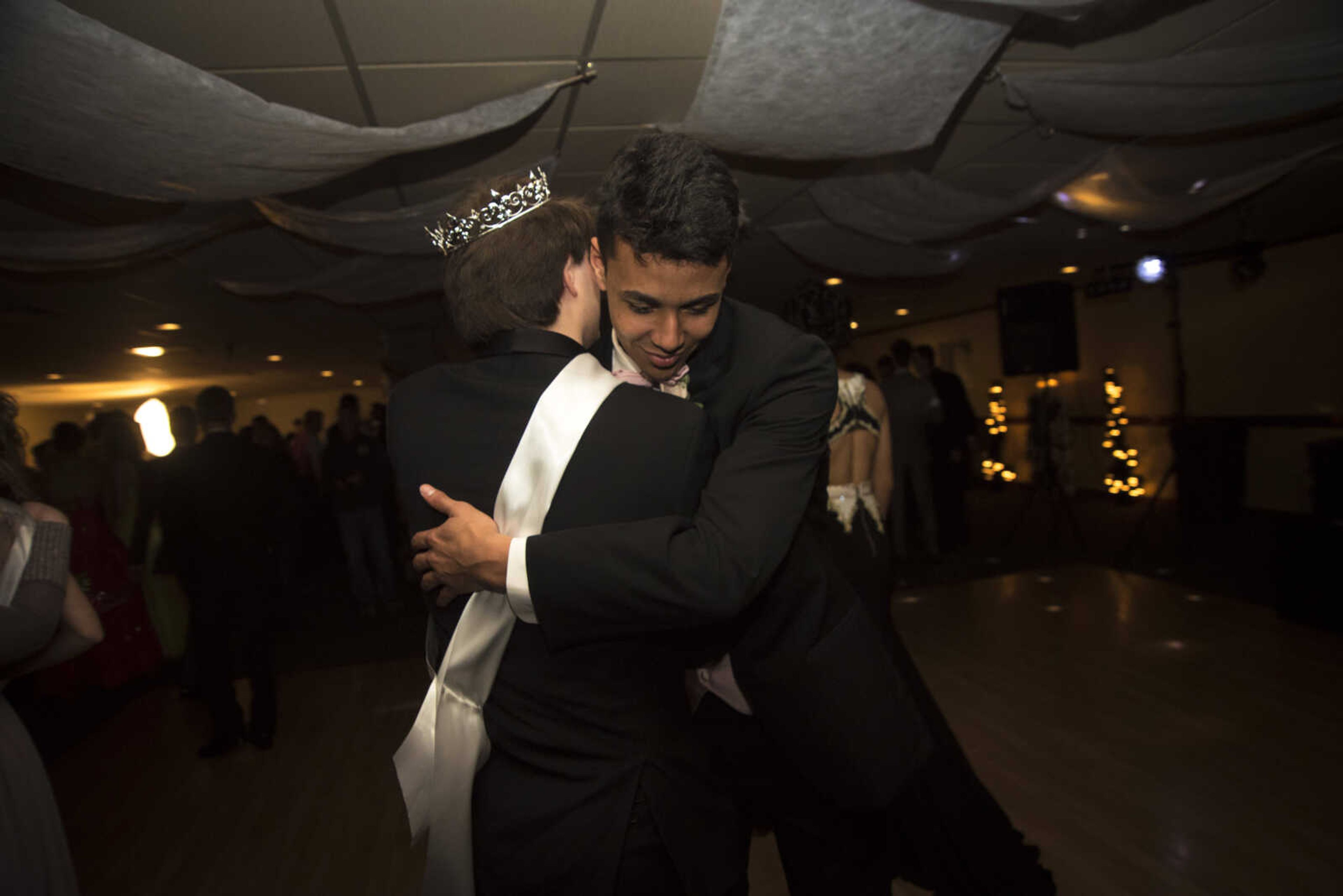 Adam Lichtenegger is congratulated on becoming prom king during the Saxony Lutheran prom Saturday, April 22, 2017 at the Elk's Lodge in Cape Girardeau.