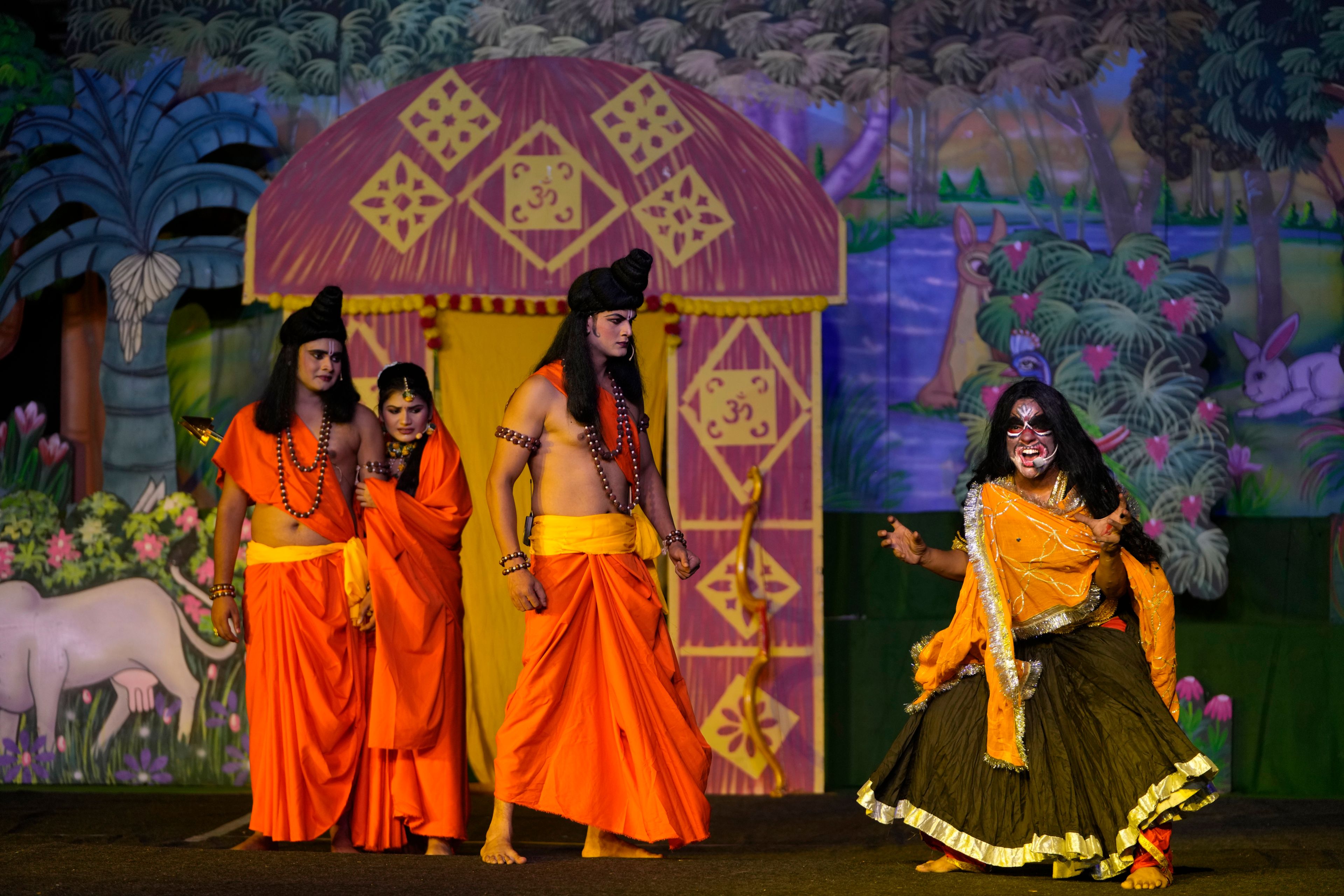 Actors perform onstage in Ramleela, a dramatic folk re-enactment of the life of Hindu god Rama according to the ancient Hindu epic Ramayana, in New Delhi, India, Wednesday, Oct. 9, 2024. (AP Photo/Manish Swarup)