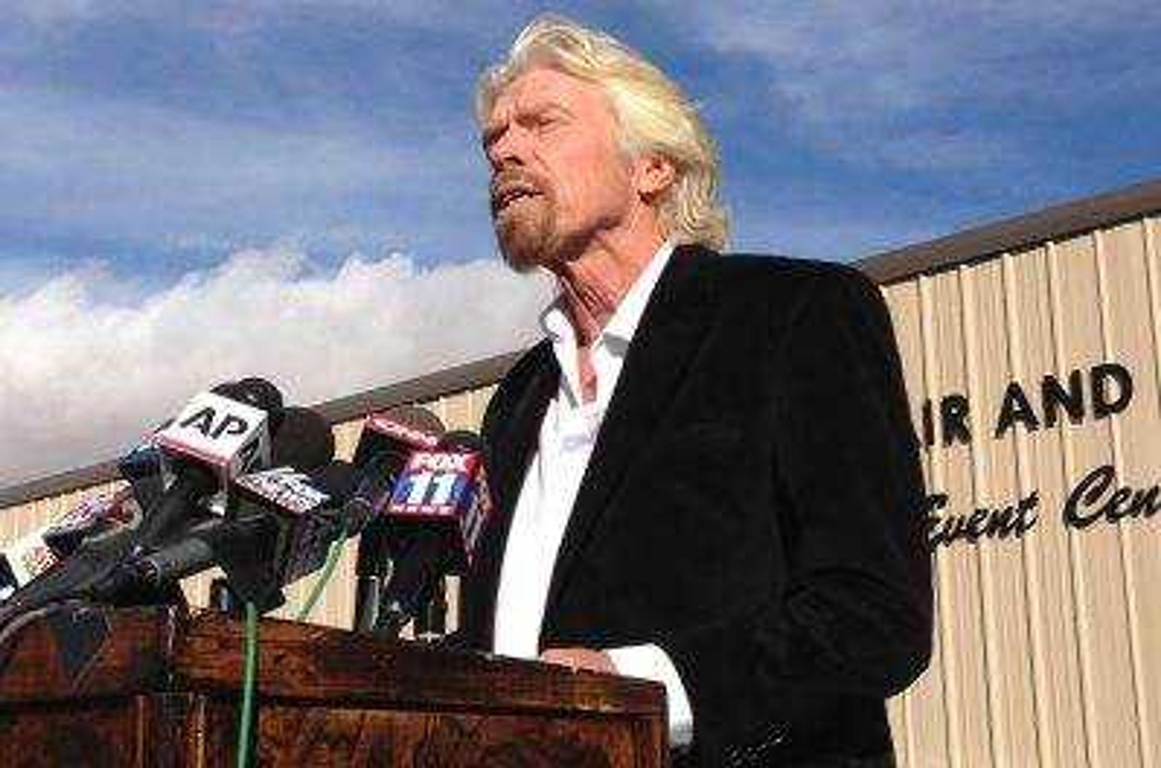 Billionaire Virgin Galactic founder Richard Branson salutes the bravery of test pilots during a news conference Saturday in Mojave, California, and vows to find out what caused the crash of his prototype space tourism rocket that killed one crew member and injured another.