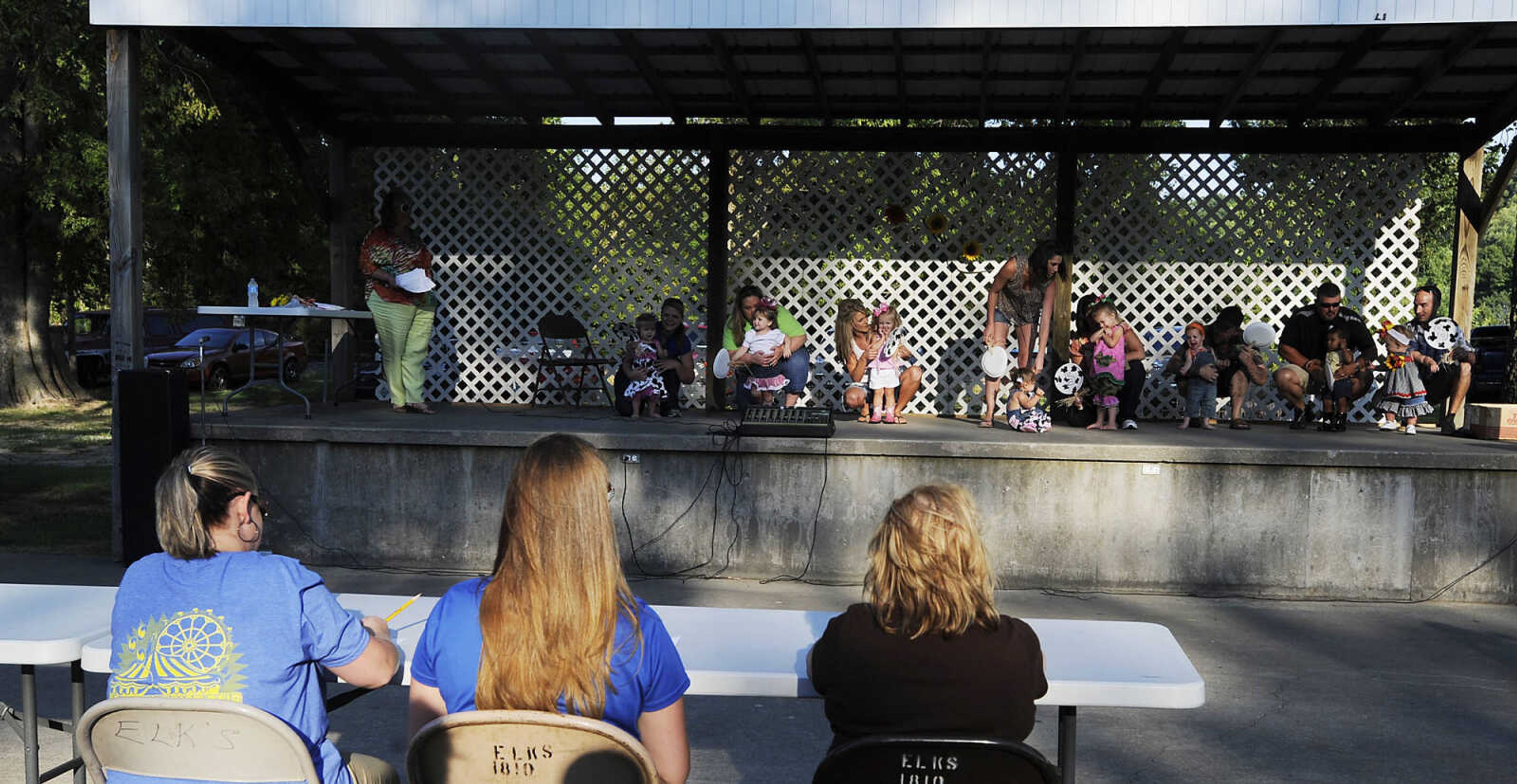 The judges take one last look at the contestants during the Mini Miss German Days Pageant during Chaffee's Annual German Days Festival Friday, August 10, at Frisco Park.