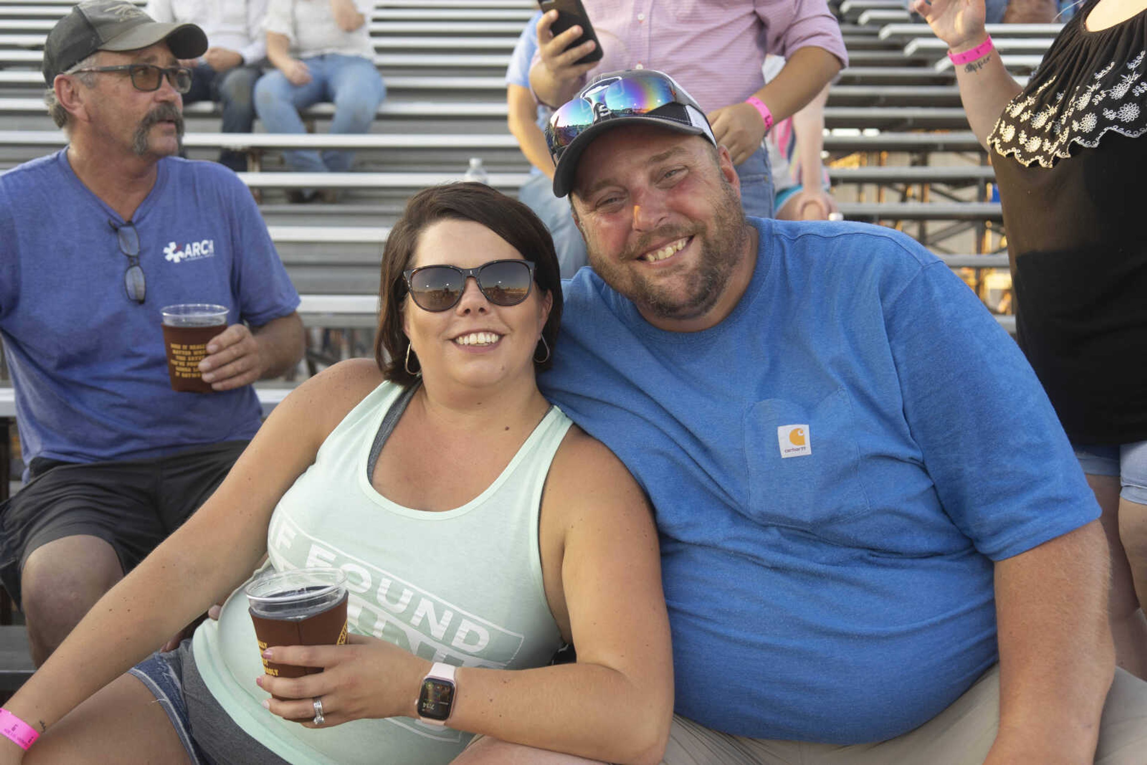 Rachelle and Adam Maue smile for a portrait during the Sikeston Jaycee Bootheel Rodeo on Thursday, Aug. 12, 2021, in Sikeston, Missouri.