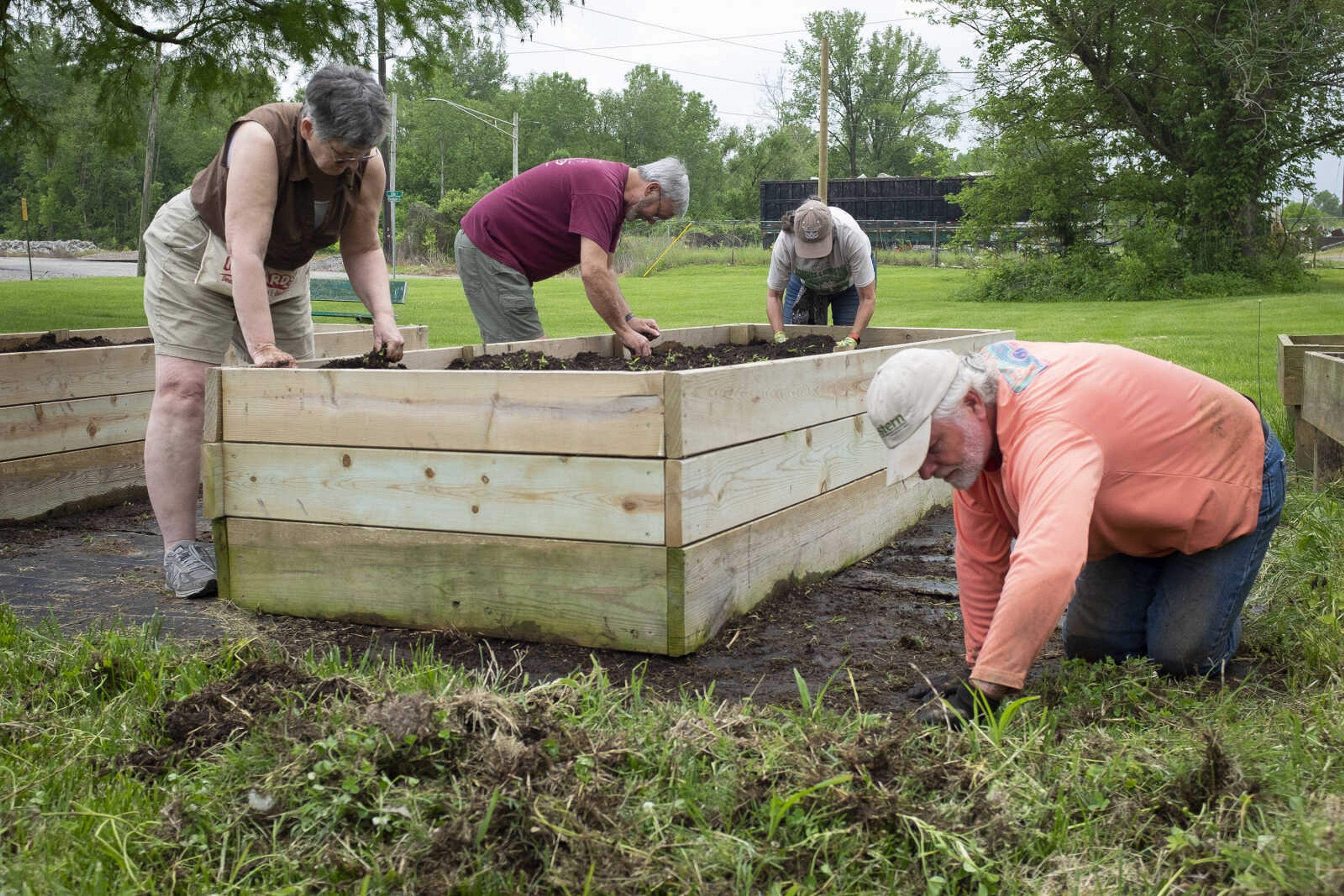 From left: Cathy Brown, her husband Bill Brown, Bonnie Coy-Svenson and her husband Sven Svenson tend to gardening tasks Saturday, May 16, 2020, at Fountain Street Community Garden in Cape Girardeau.