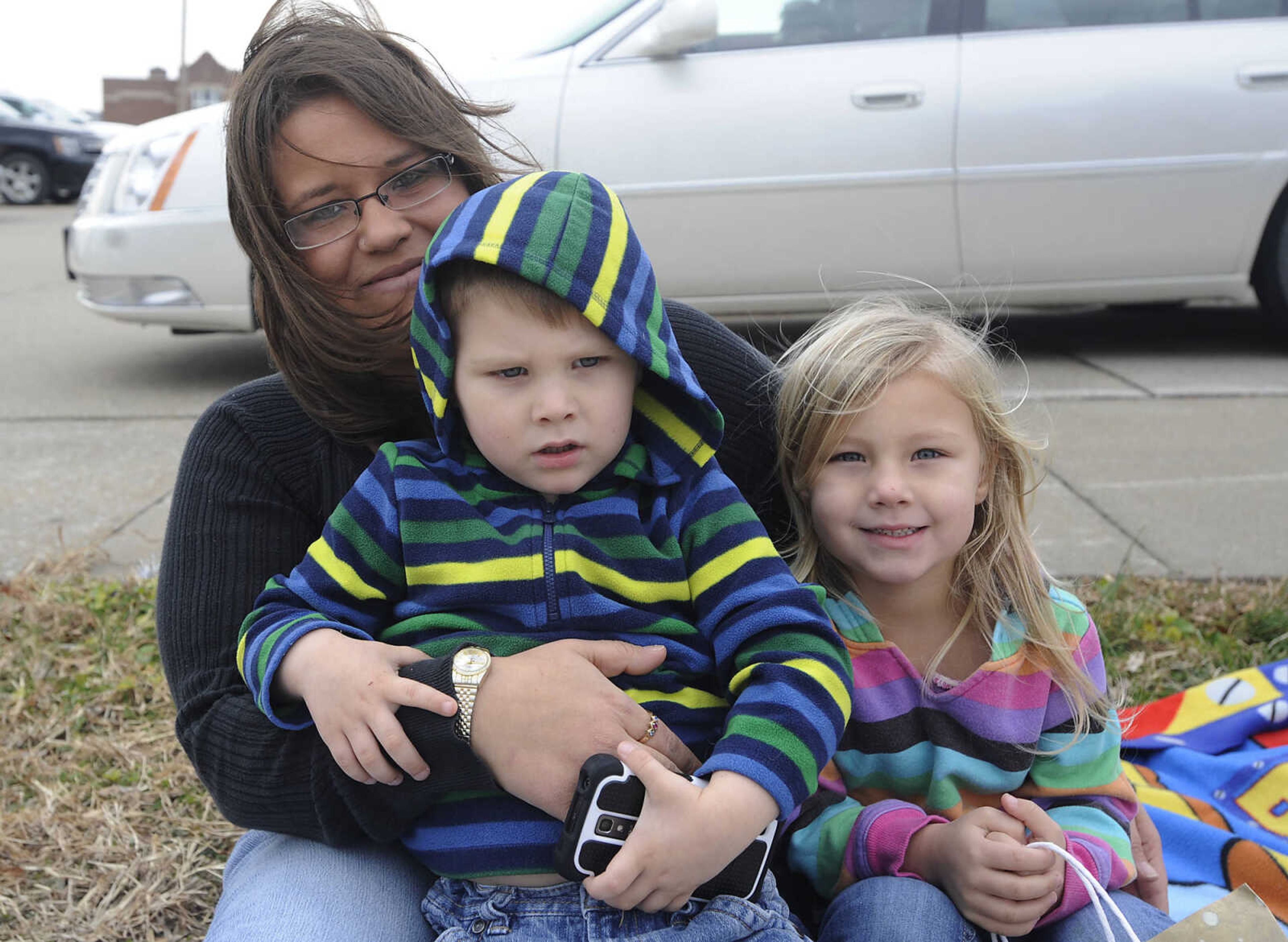 Christy, left, Terrance, 3, and Mackenzie Duvall, 4, at the Jackson Jaycee Foundation Christmas Parade Saturday, Dec. 1, in Jackson.