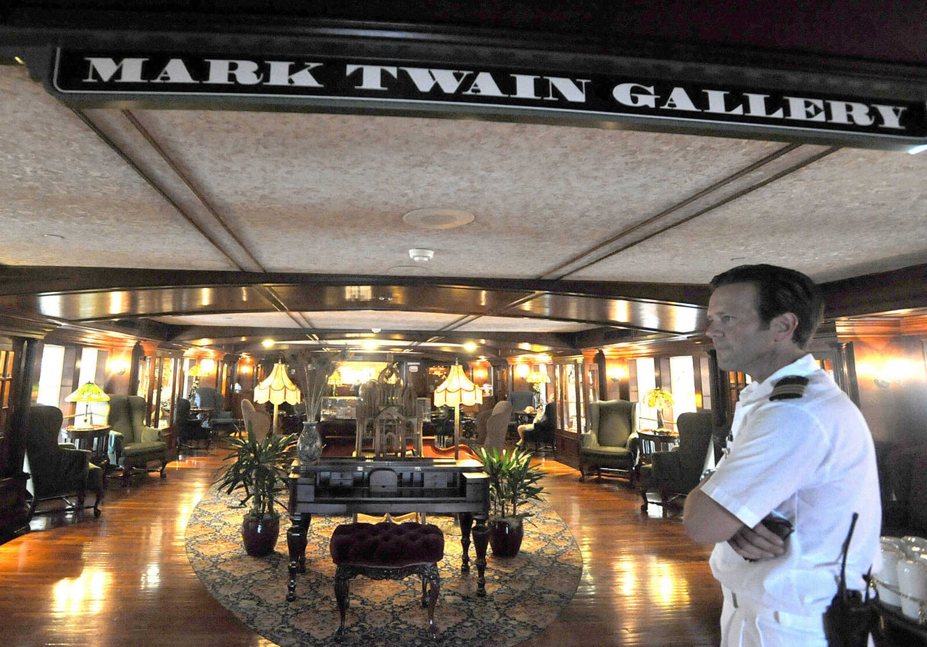 LAURA SIMON ~ lsimon@semissourian.com
Chief Mate John Cook shows the Mark Twain Gallery on the second deck of the American Queen steamboat Monday, July 2, 2012 as it is docked in downtown Cape Girardeau.