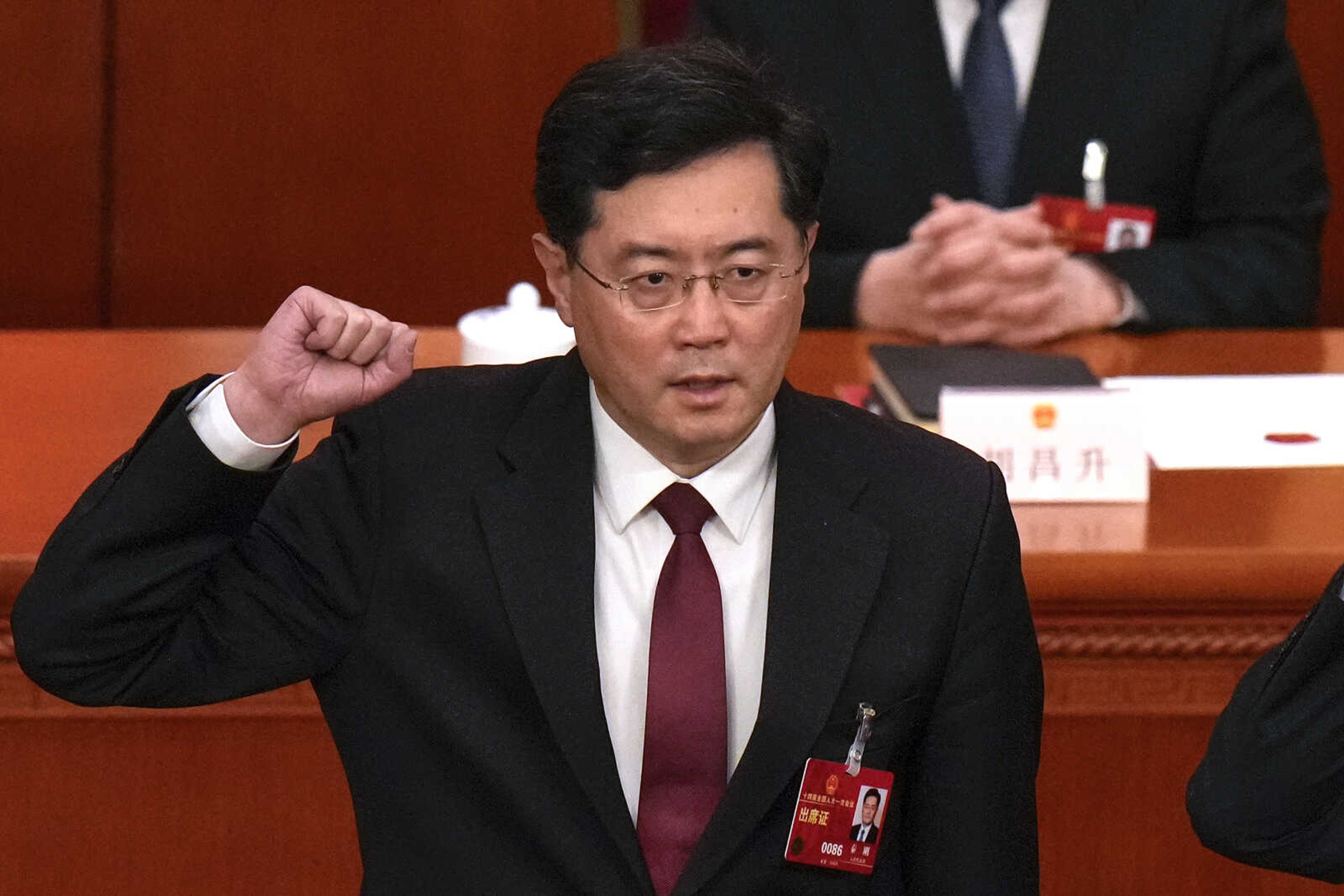 FILE - Then newly elected Chinese Foreign Minister Qin Gang takes his oath during a session of China's National People's Congress (NPC) at the Great Hall of the People in Beijing on March 12, 2023. Analysts say the removal of China's foreign and defense ministers appears to enforce leader Xi Jinping's demand for total obedience and the elimination of any potential rivals within the ruling Communist Party. (AP Photo/Andy Wong, File)