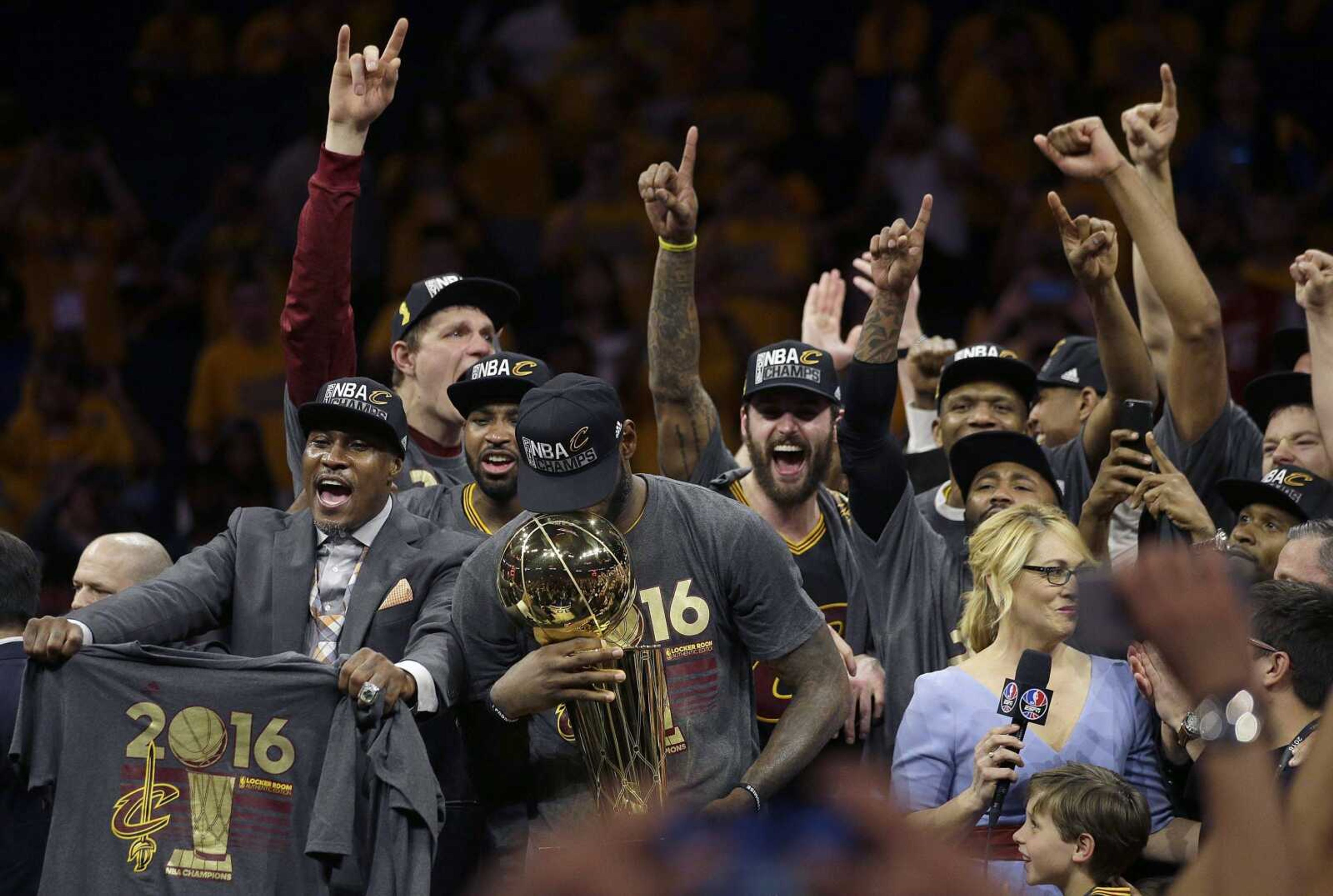 Cavaliers forward LeBron James, center, celebrates with teammates after Game 7 of the NBA Finals against the Warriors on Sunday in Oakland, California. The Cavaliers won 93-89.