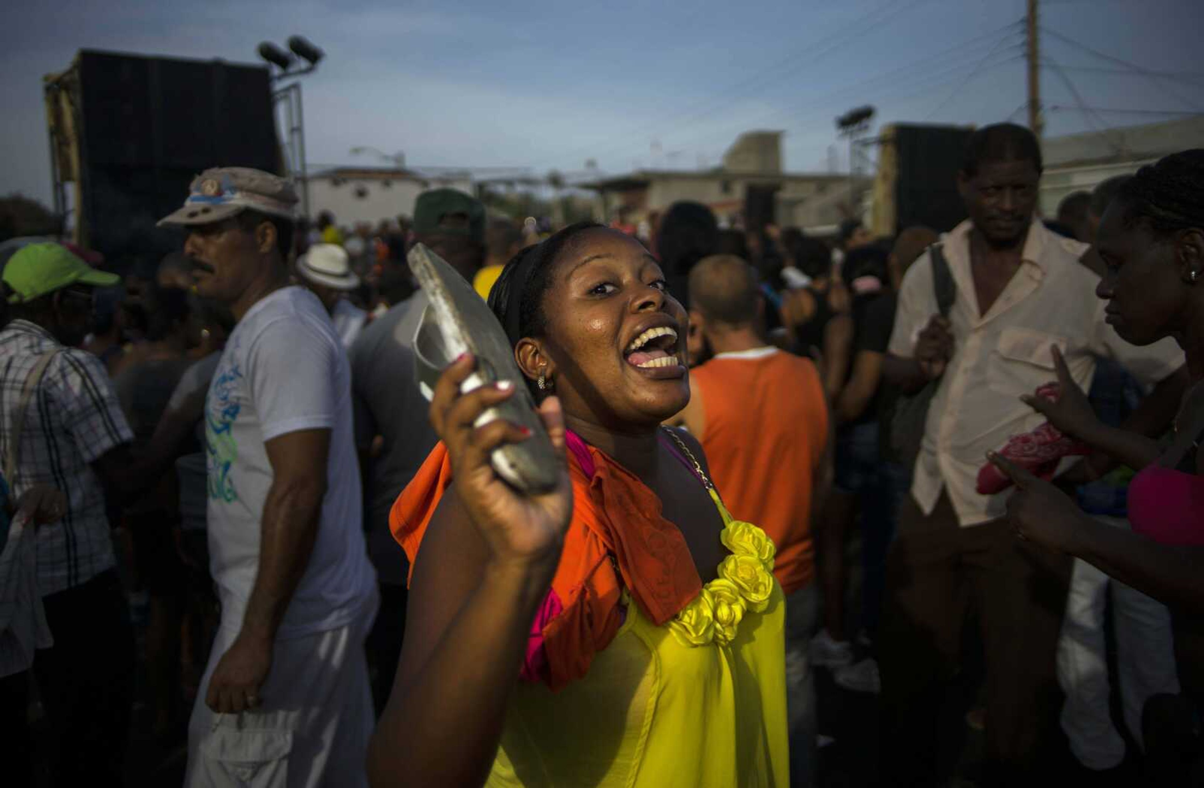 A woman sings and dances during a carnival concert in Santiago, Cuba. (Ramon Espinosa ~ Associated Press)