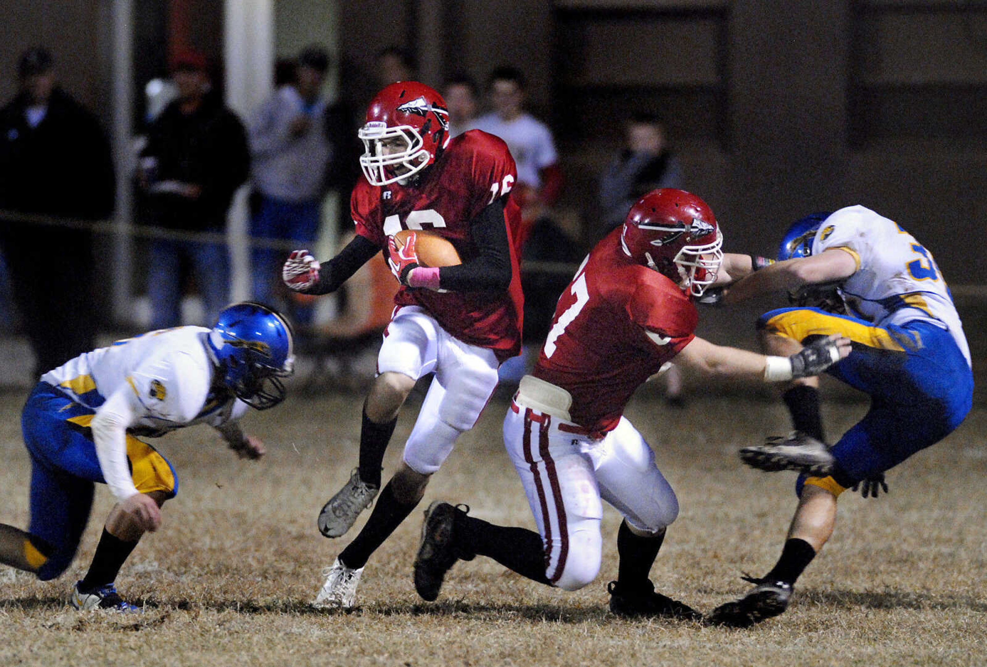 Jackson's Skyler Steele avoids Seckman's Tanner Harry, left, as Jackson's Justin Legrand blocks Seckman's Sean Thomas, right, during the first quarter of a game on Friday, Oct. 21, 2011, in Jackson. Jackson won 8-7. (Kristin Eberts)