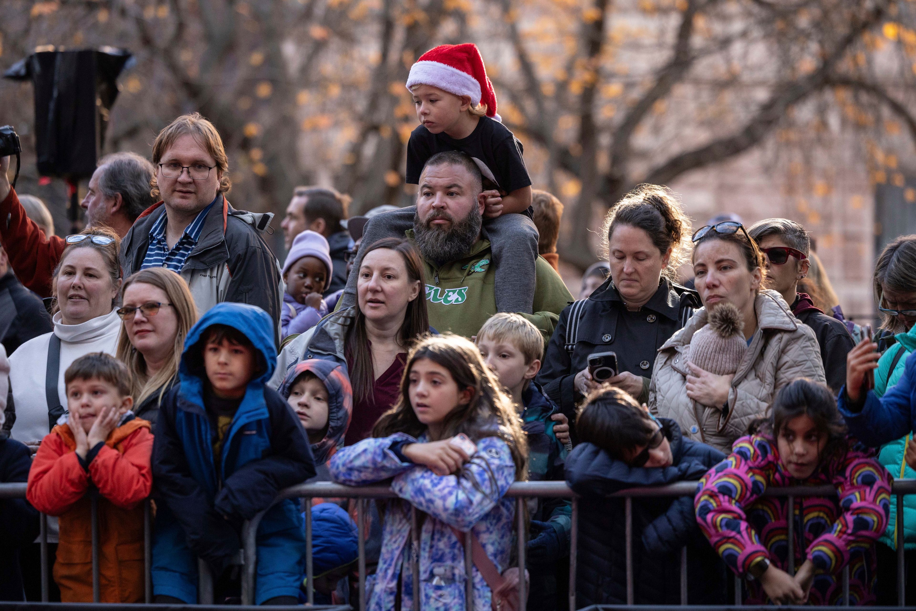 People watch floats being inflated in preparation for the Macy's Thanksgiving Day Parade, Wednesday, Nov. 27, 2024, in New York. (AP Photo/Yuki Iwamura)