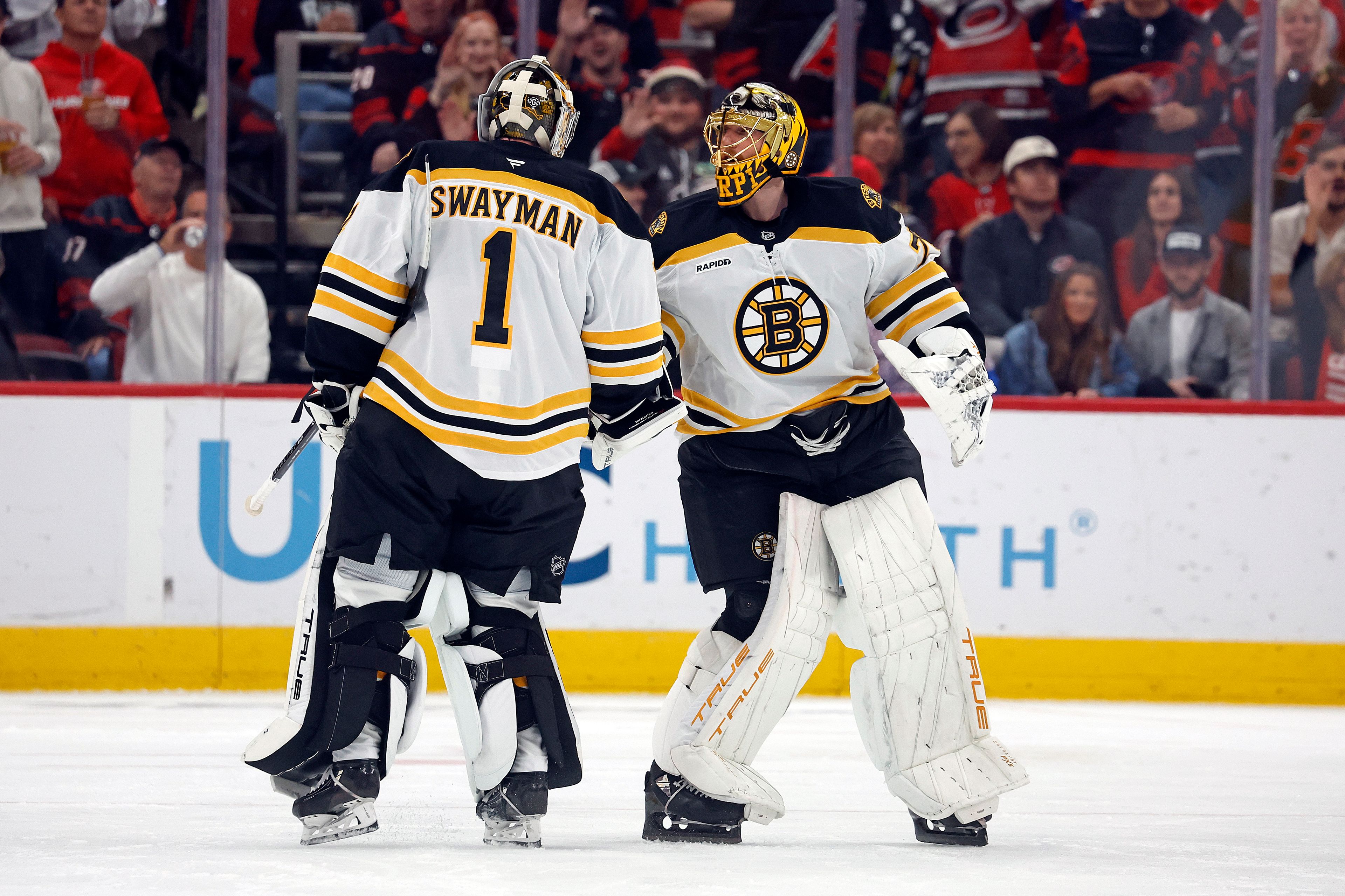 Boston Bruins goaltender Joonas Korpisalo (70) replaces goaltender Jeremy Swayman (1) after Swagman is pulled during the second period of an NHL hockey game against the Carolina Hurricanes in Raleigh, N.C., Thursday, Oct. 31, 2024. (AP Photo/Karl B DeBlaker)