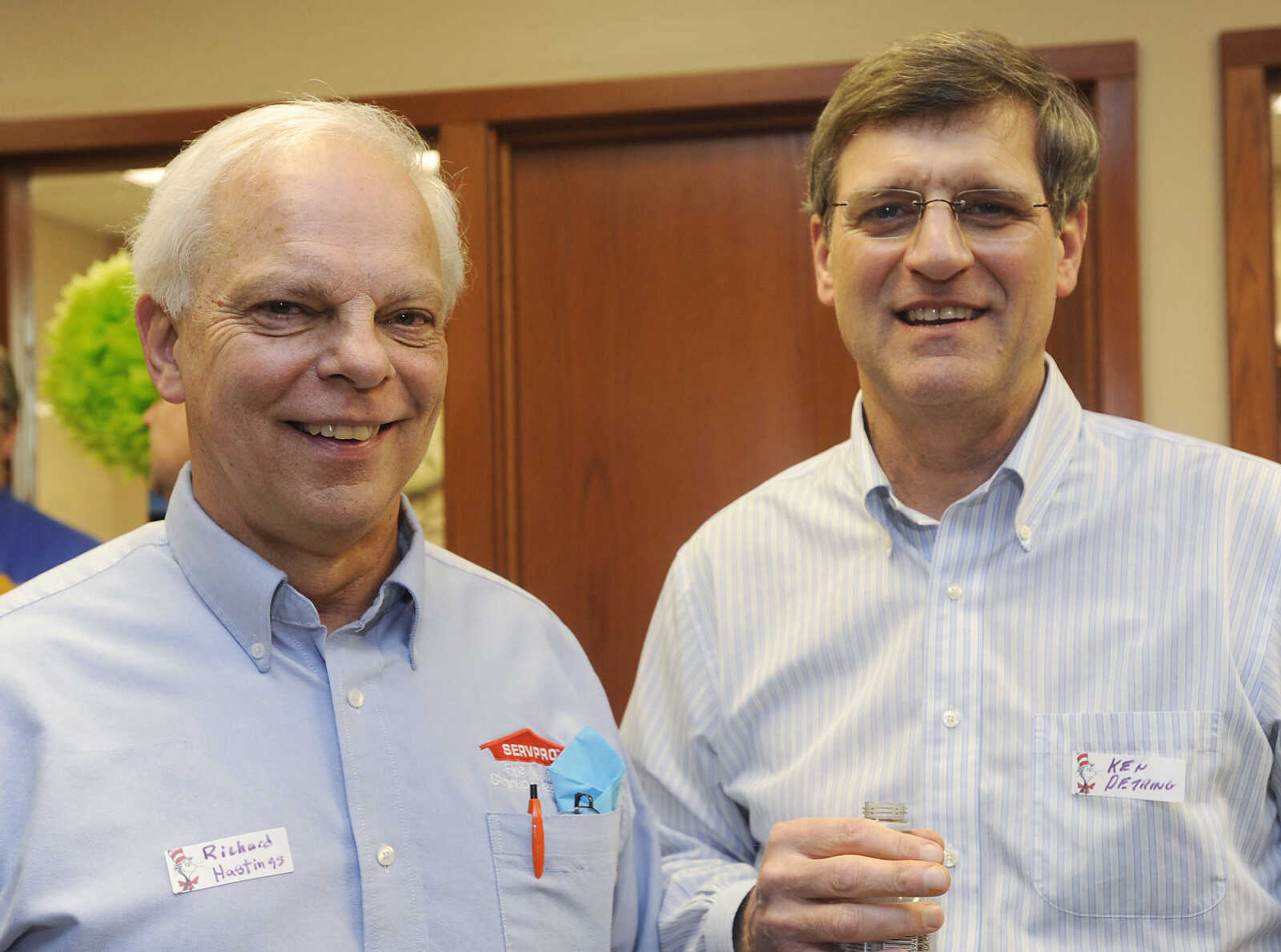 Richard Hastings of ServPro, left, and Ken Petring of Eye Care Centers of Jackson at the Jackson Chamber of Commerce after hours event Tuesday, March 12, at The Bank of Missouri.