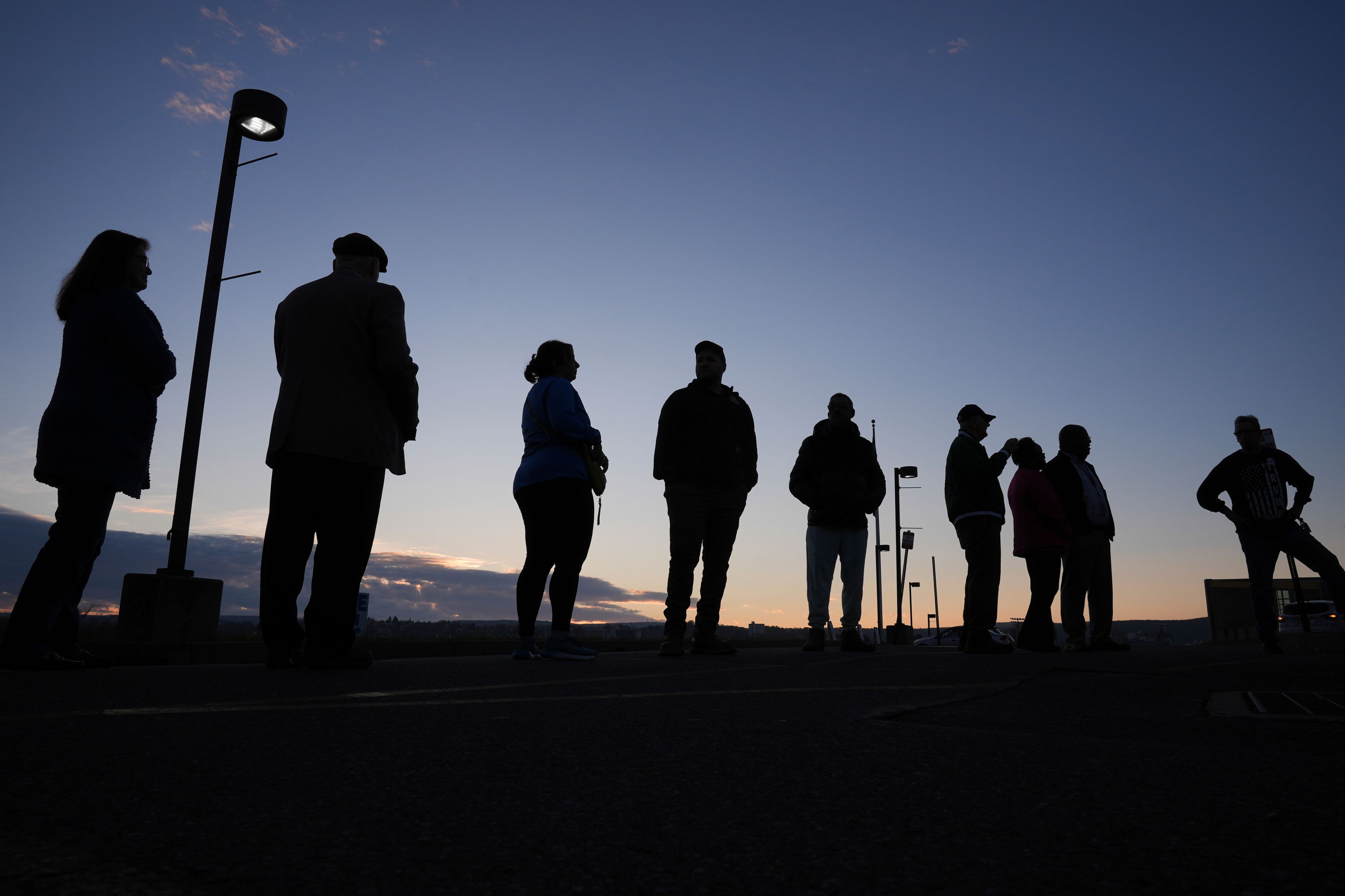 Voters wait in line to cast their ballots at Scranton High School in Scranton, Pa., on Election Day, Tuesday, Nov. 5, 2024. (AP Photo/Matt Rourke)