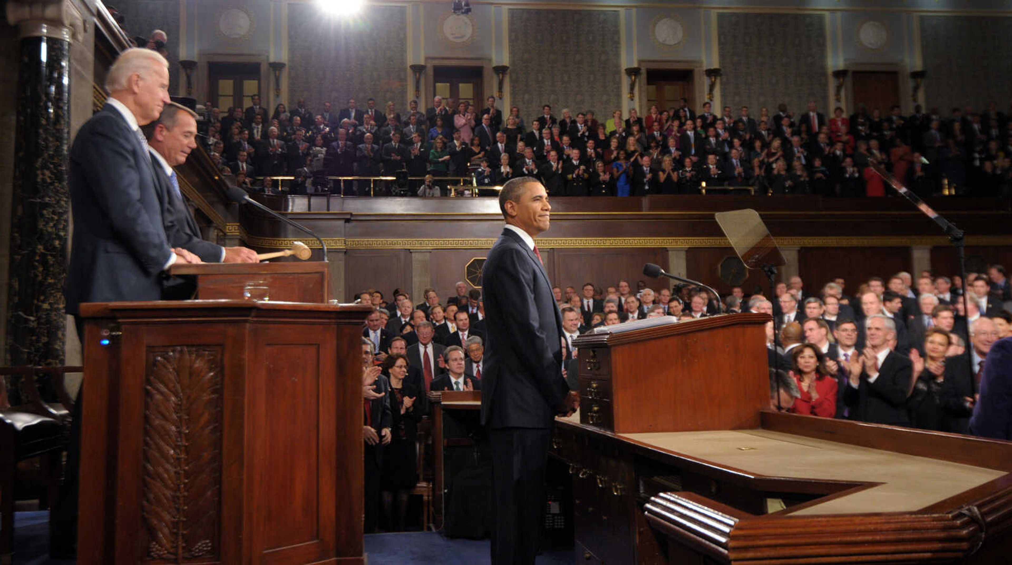 President Barack Obama pauses before he delivers his State of the Union address on Capitol Hill in Washington, Tuesday, Jan. 24, 2012. At left are Vice President Joe Biden and House Speaker John Boehner. (AP Photo/Saul Loeb, Pool)