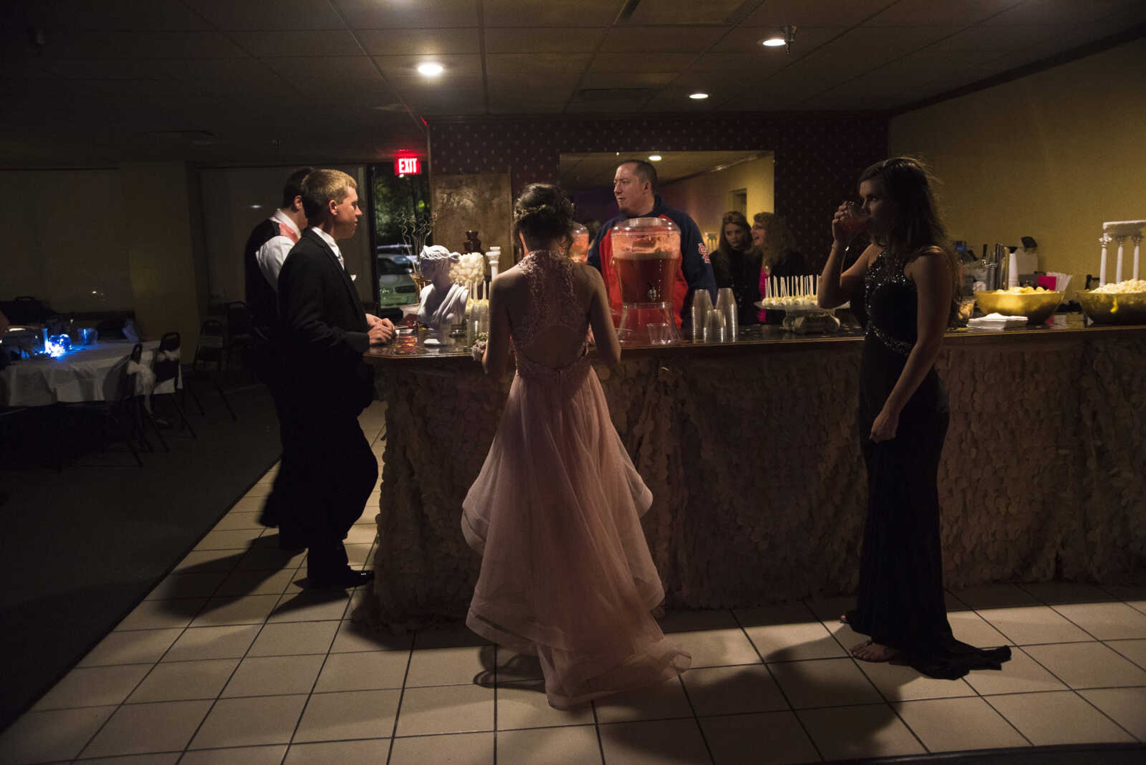 Students wait for refreshments during the Saxony Lutheran prom Saturday, April 22, 2017 at the Elk's Lodge in Cape Girardeau.