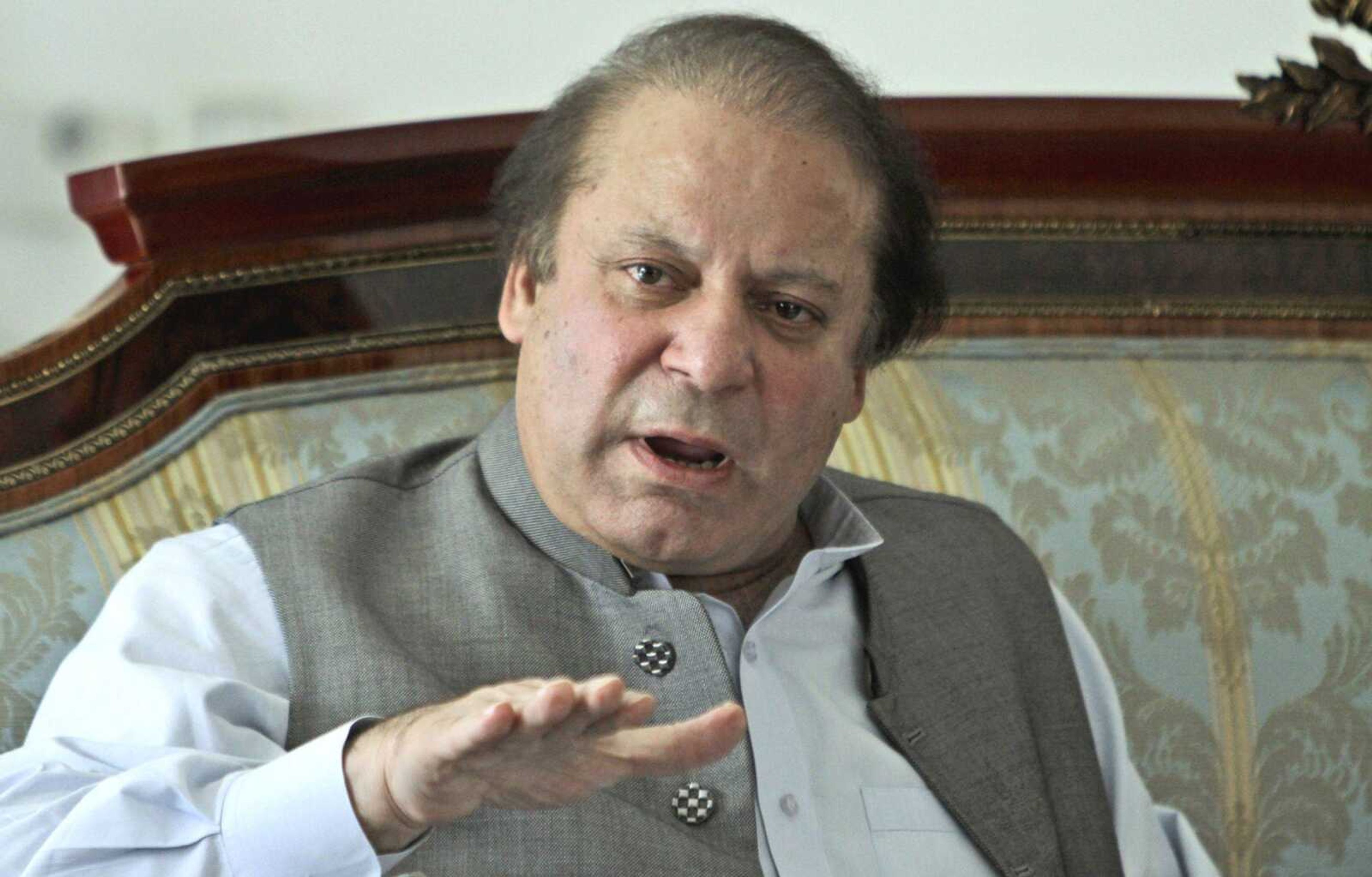 Former prime minister and leader of Pakistan Muslim League-N party, Nawaz Sharif, speaks to members of the media Monday at his residence in Lahore, Pakistan. (K.M. Chaudary ~ Associated Press)