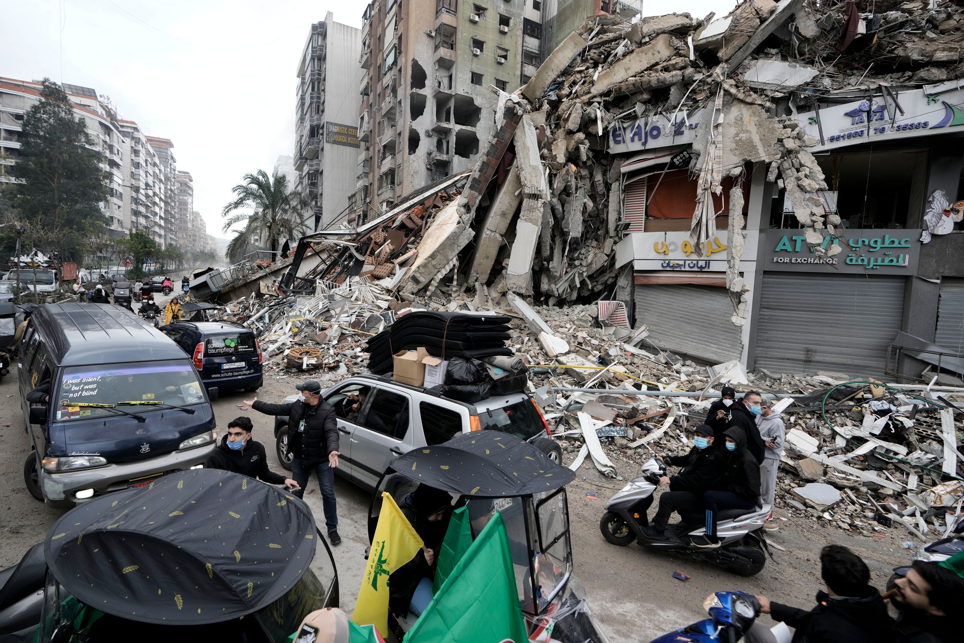 Displaced residents return to Dahiyeh, in Beirut, Lebanon, following a ceasefire between Israel and Hezbollah that went into effect on Wednesday, Nov. 27, 2024. (AP Photo/Bilal Hussein)